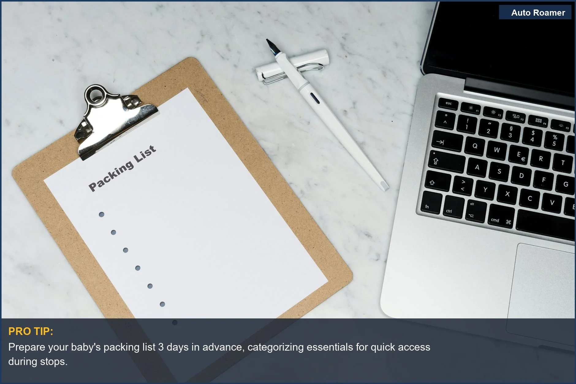 Organized flat lay shows a detailed baby road trip packing list clipboard, laptop, and pen on a stylish marble desk.