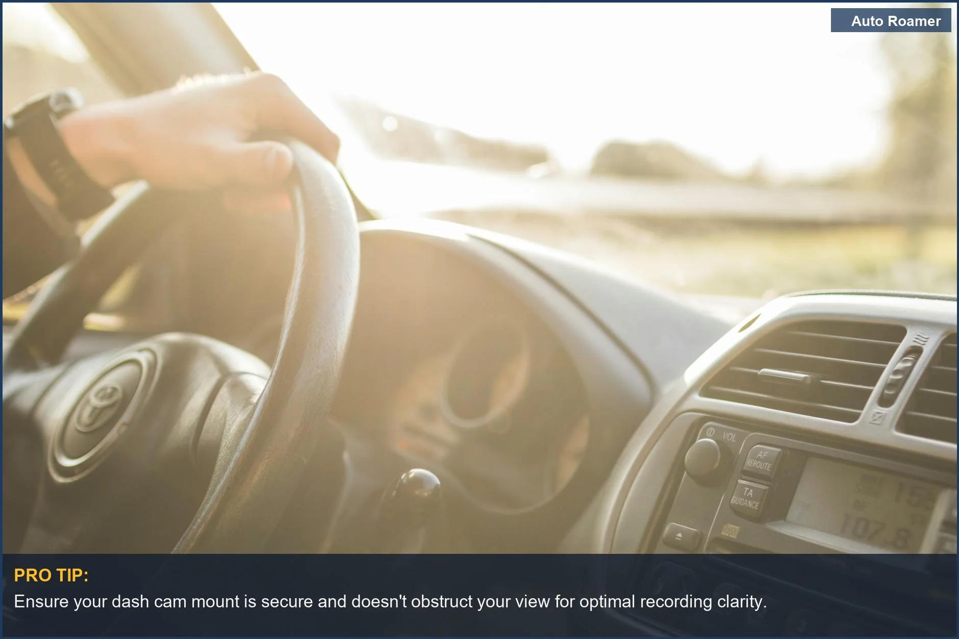 Sunlit car interior with a focus on the steering wheel, illustrating the driver's perspective for dash cam footage.