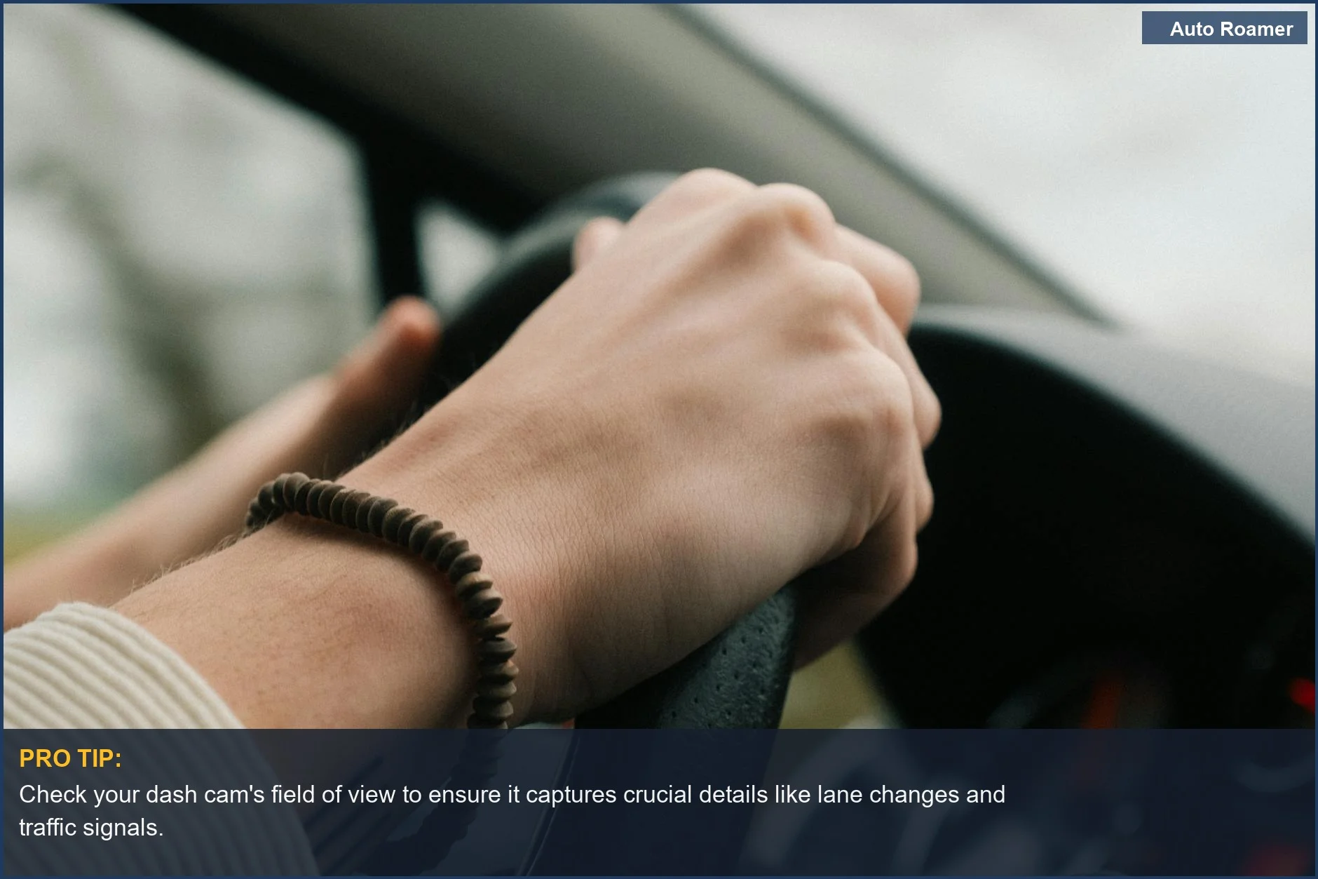 Driver's hands on the steering wheel, showing control and focus while on the road.