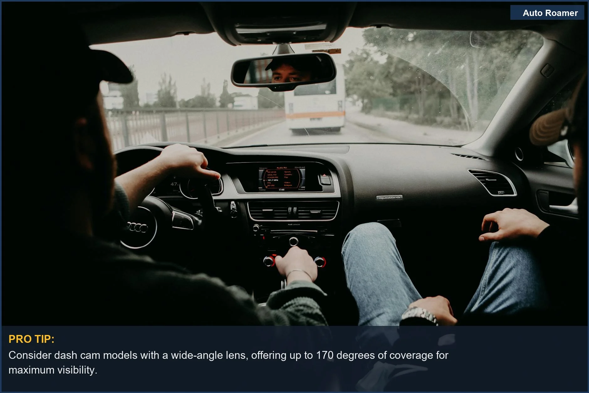 View from inside a moving car with two passengers on a road trip, demonstrating passenger perspective.