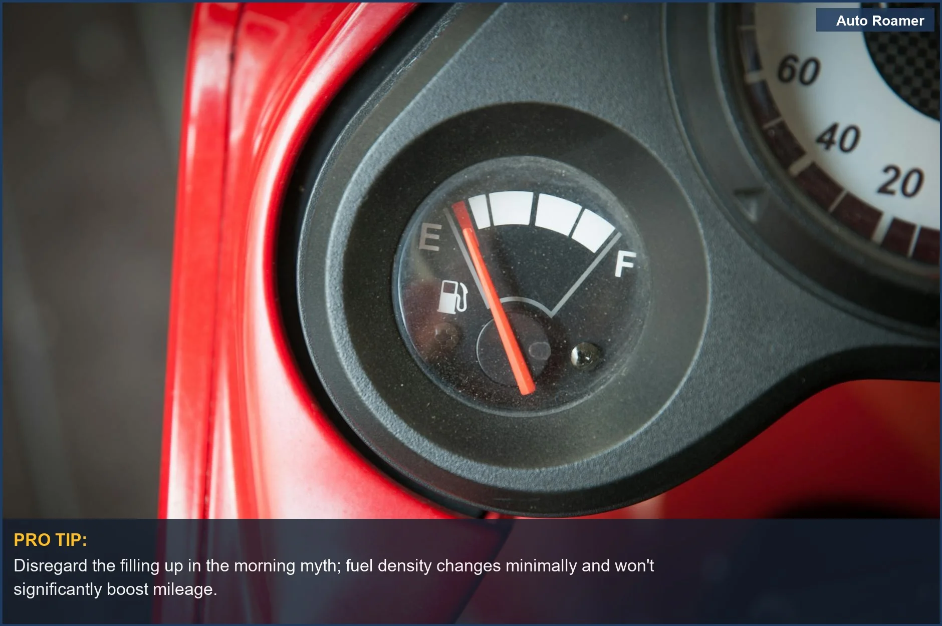 Car fuel gauge needle pointing to empty, illustrating the filling up in the morning myth.