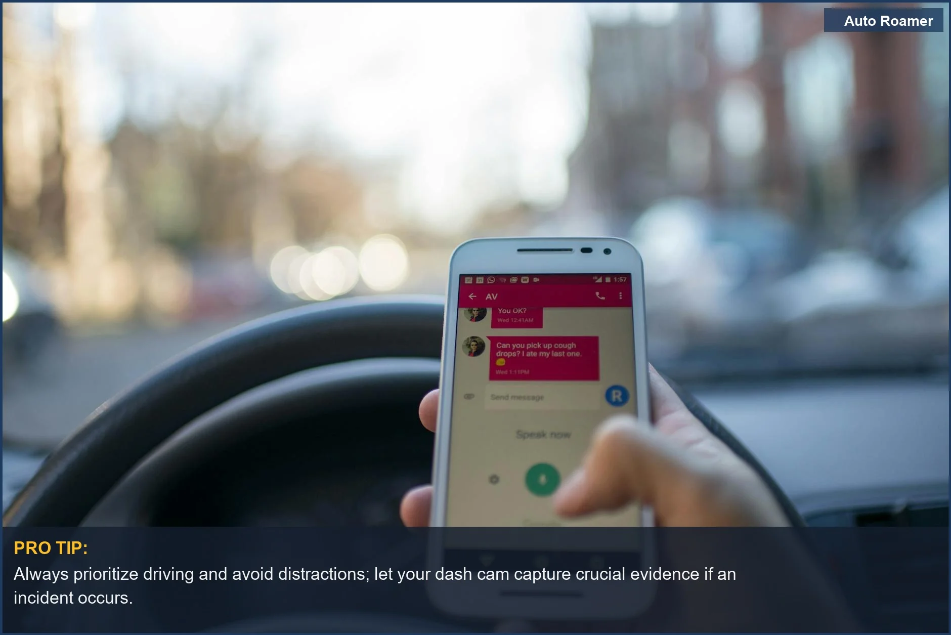 Driver distracted by smartphone while driving in a city, illustrating the need for reliable dashcam footage like from the Garmin 67W.