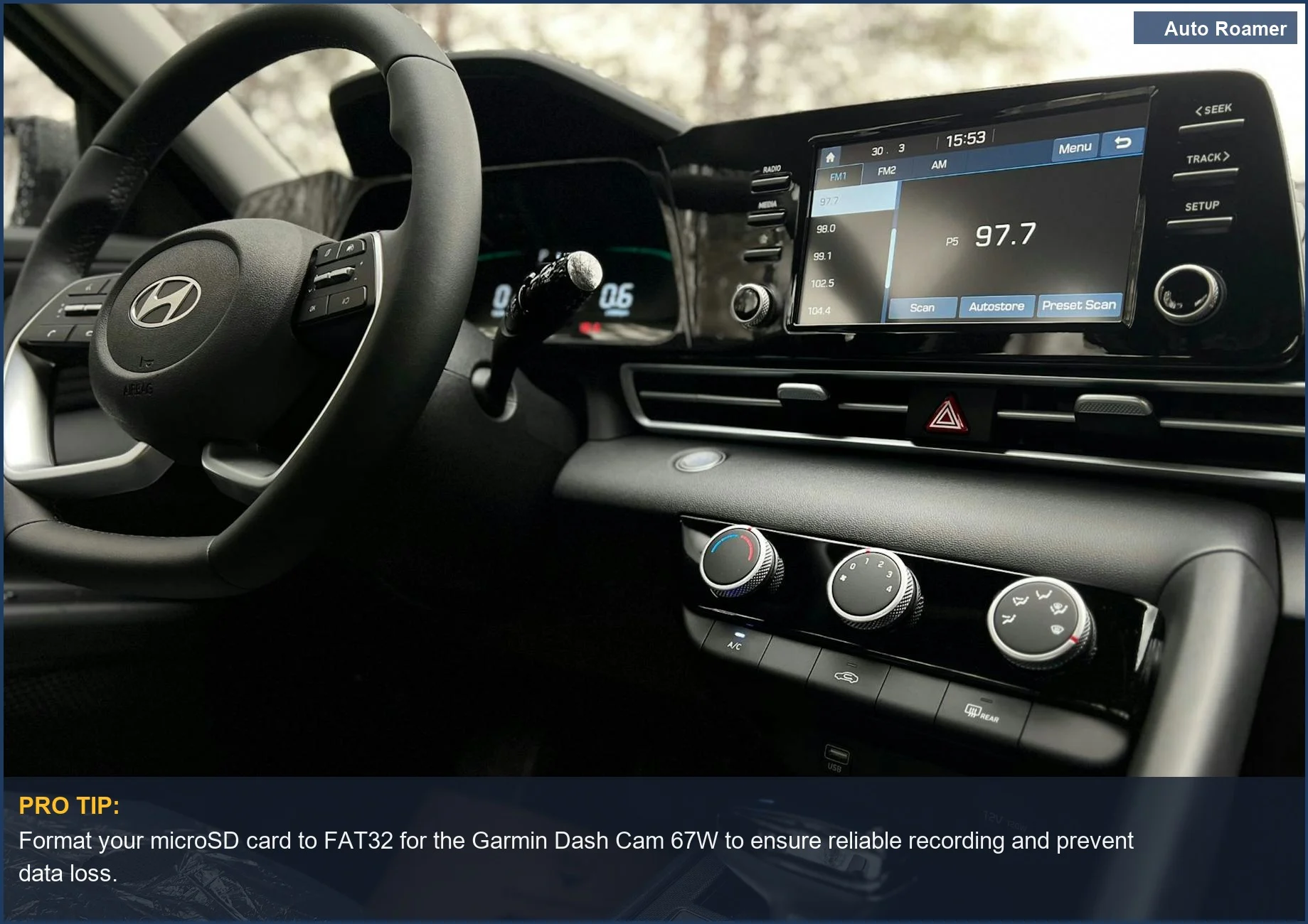 Close-up of a car's modern touchscreen infotainment system and steering wheel, showing the type of tech compatible with Garmin dashcams.