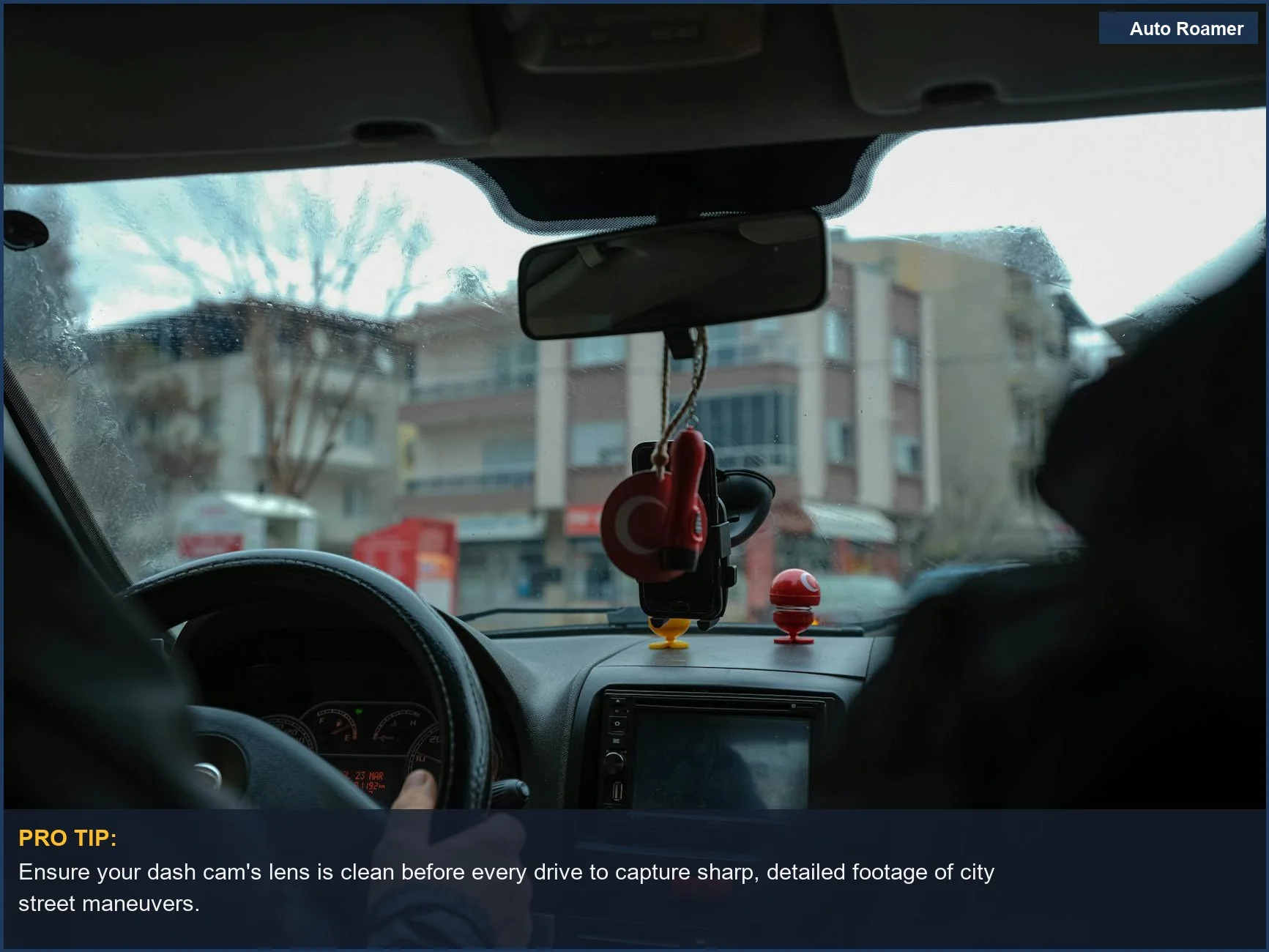 Navigate city streets with confidence using the discreet Garmin Dash Cam Mini 2, providing a clear driver's perspective.