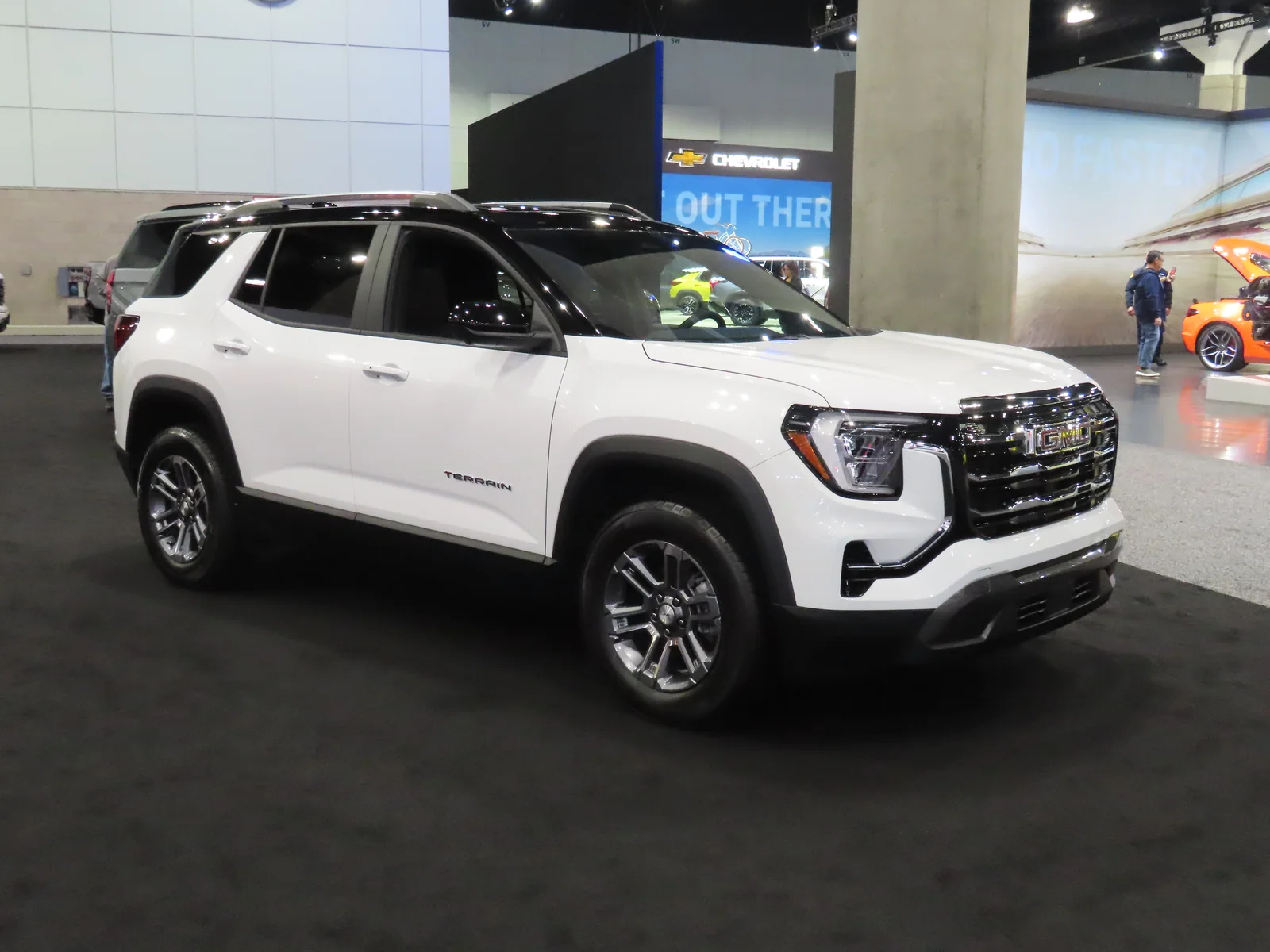 A white GMC Terrain Elevation compact SUV, current third generation, parked in a front three-quarter view, the vehicle these camping accessories are chosen for.
