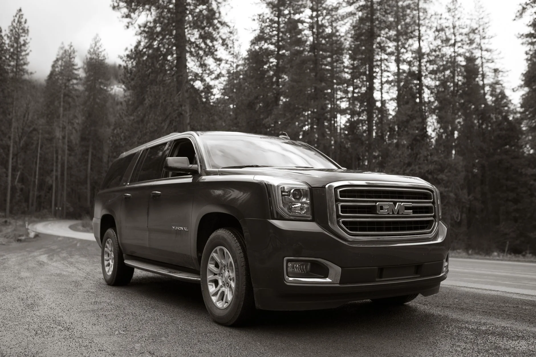 A full-size SUV set up for a road trip and car camping, the use case the Yukon's deep cargo hold is built for.