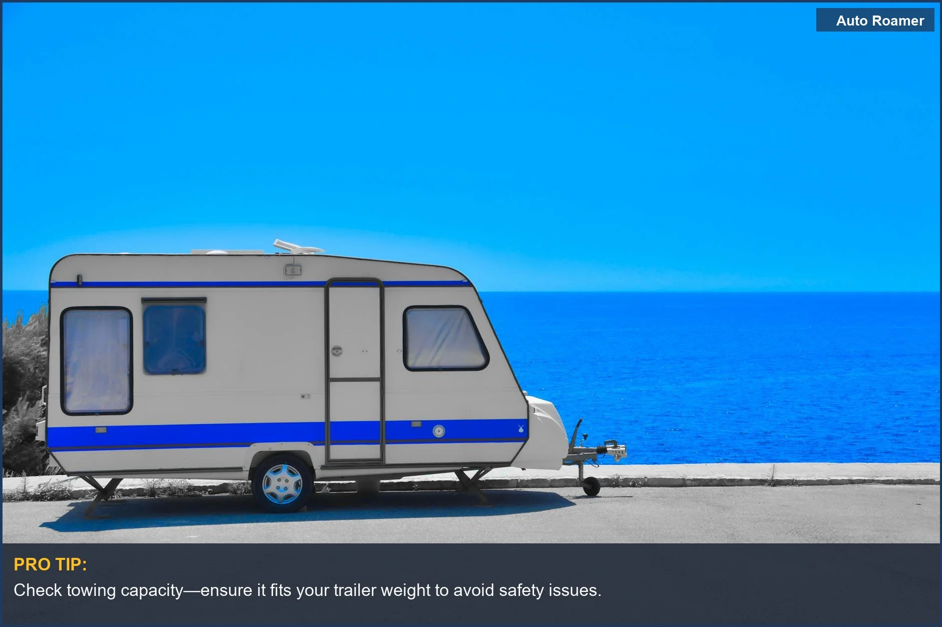 Parked camper trailer by the sea showcasing the GMC Yukon towing travel trailer capabilities.