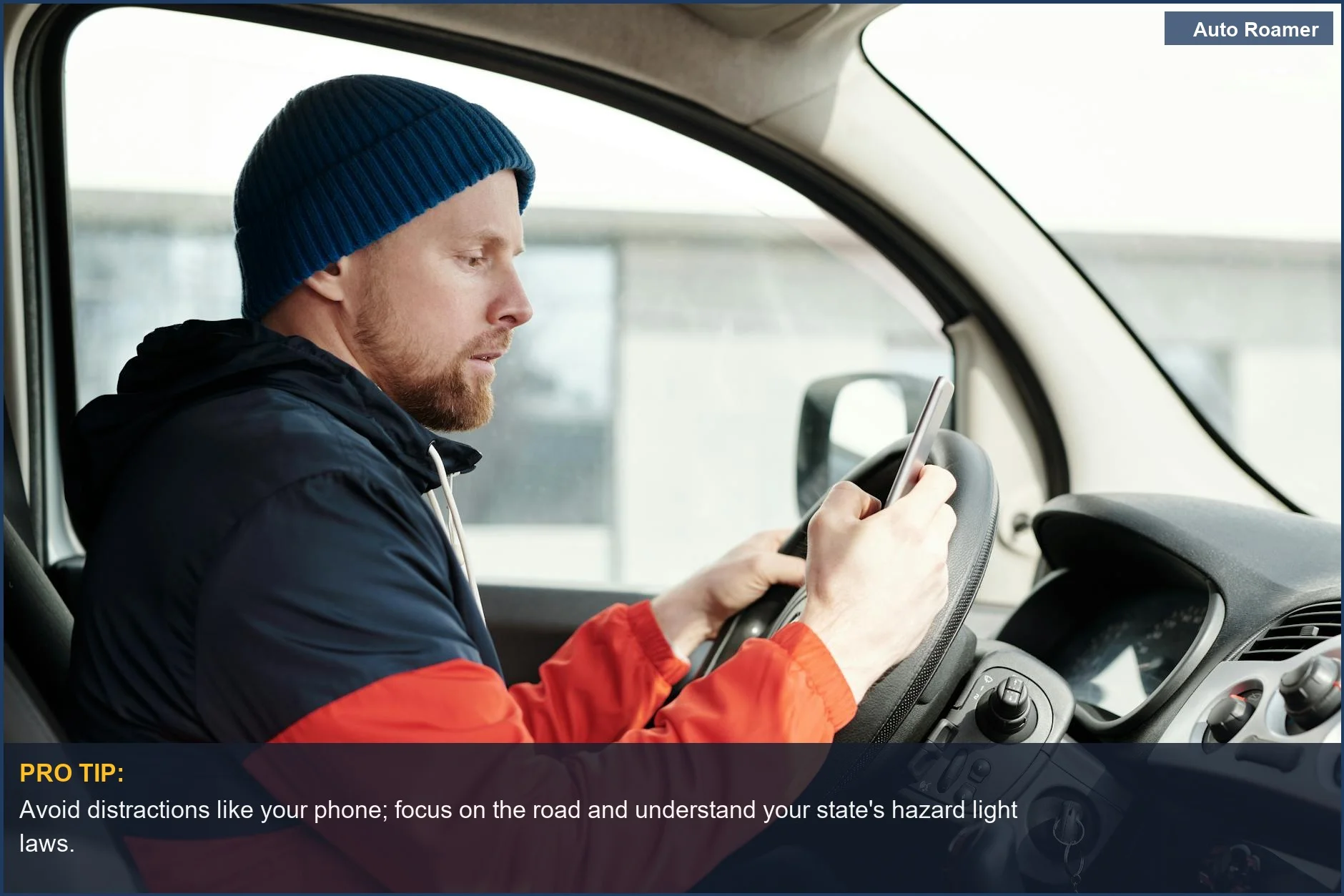 Distracted driver on smartphone, highlighting why hazard lights in rain are often illegal and dangerous.