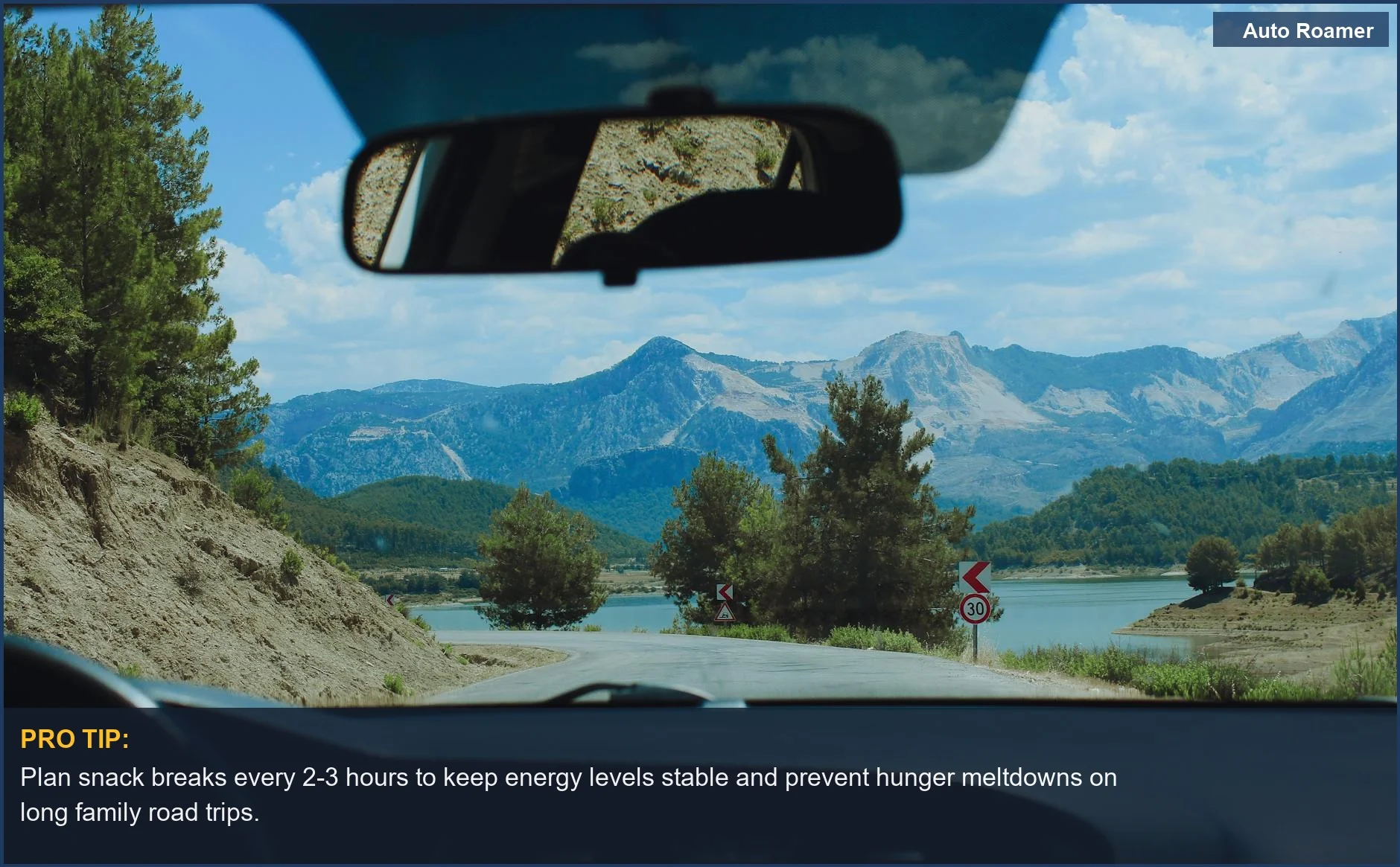 A stunning view of a winding mountain road from a car, inspiring adventures with healthy snacks for kids on road trips.