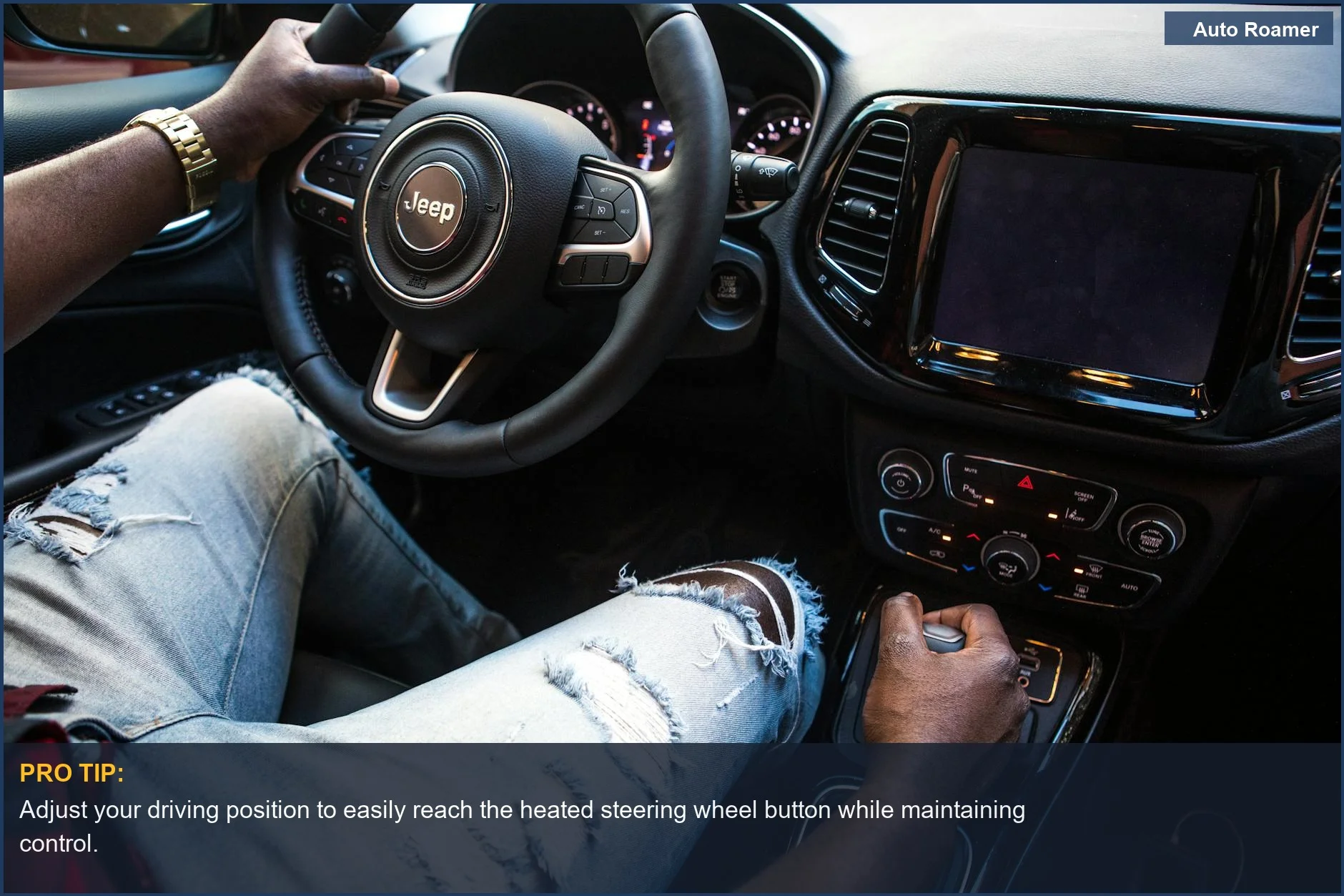 Man driving a Jeep SUV, focusing on the steering wheel equipped with a heated steering wheel button.