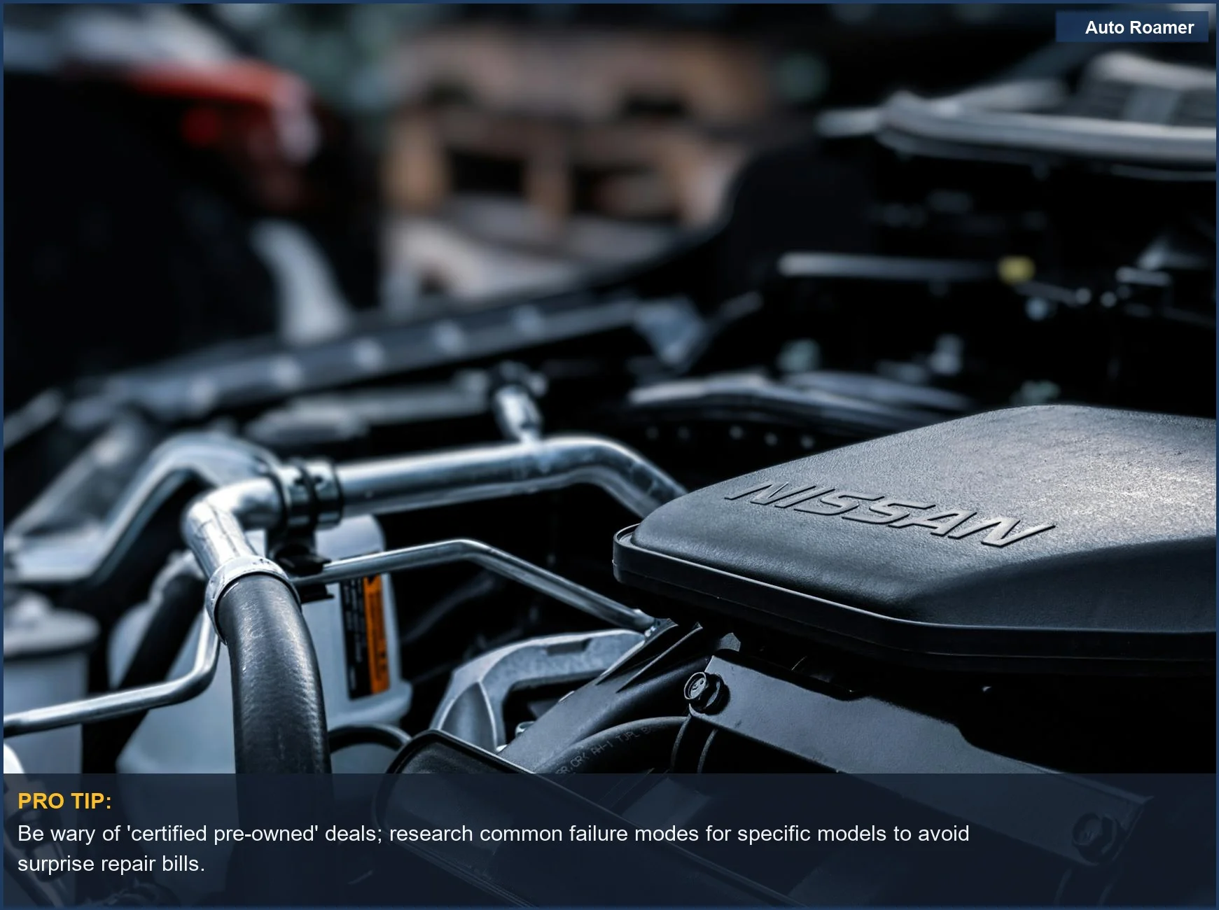 Detailed view of a car engine compartment with Nissan branding, hinting at mechanical repair expenses.
