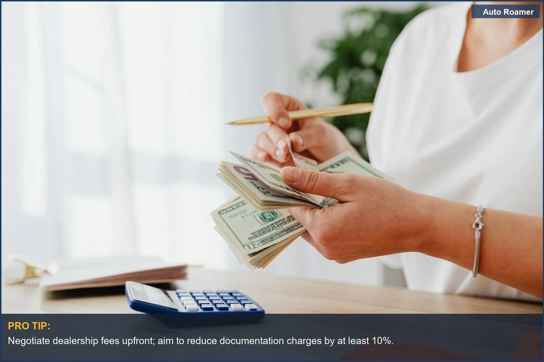 Woman calculating finances at home, illustrating hidden car trade-in costs and dealership fees.