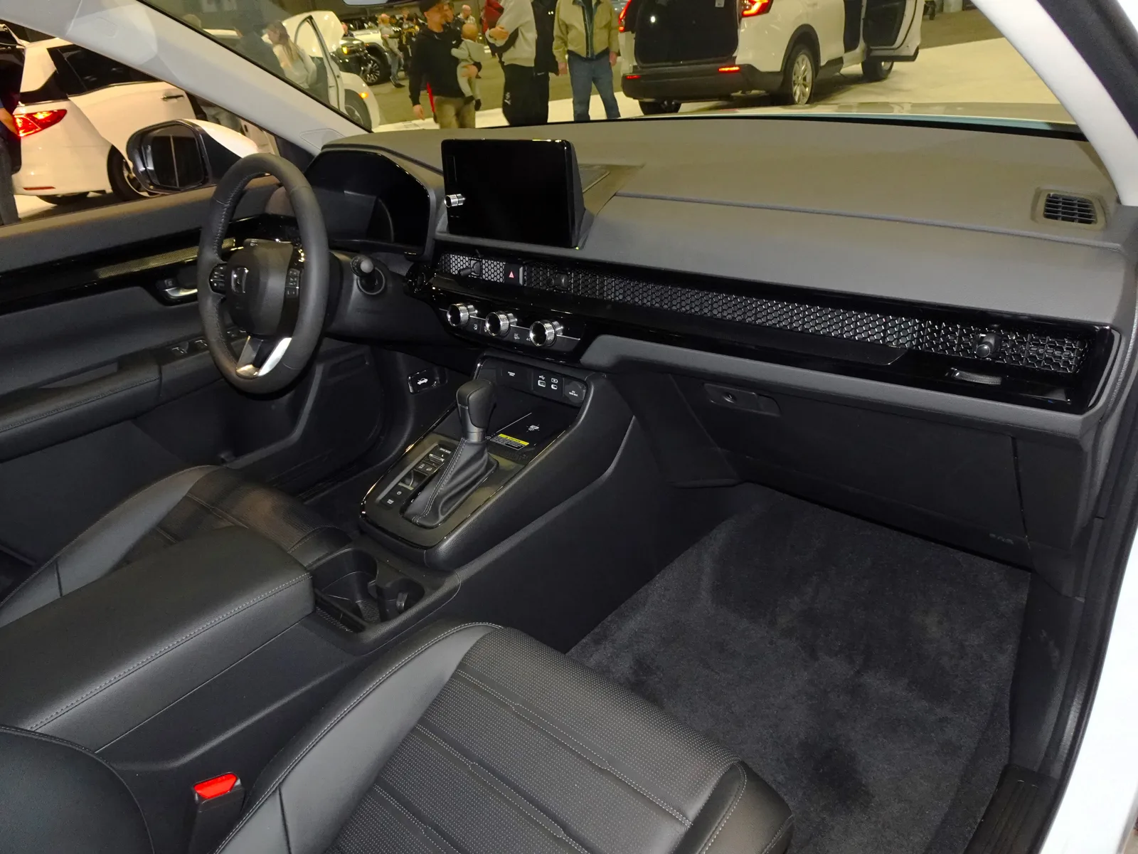 The cabin and dashboard inside a current Honda CR-V, the interior this cargo-dimensions-for-sleeping guide folds into a bed