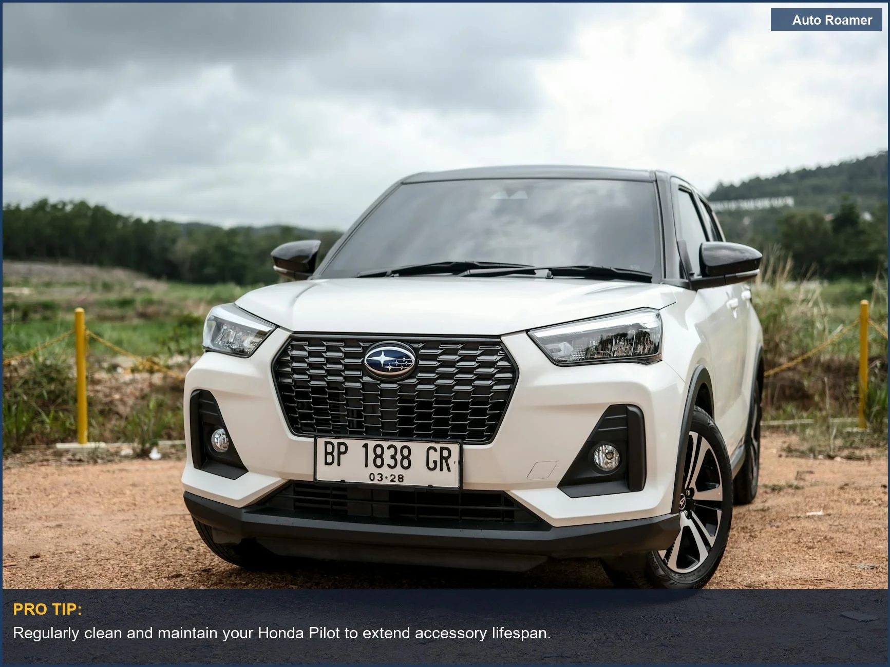 White SUV on a dirt road, showcasing modern design and camping readiness.