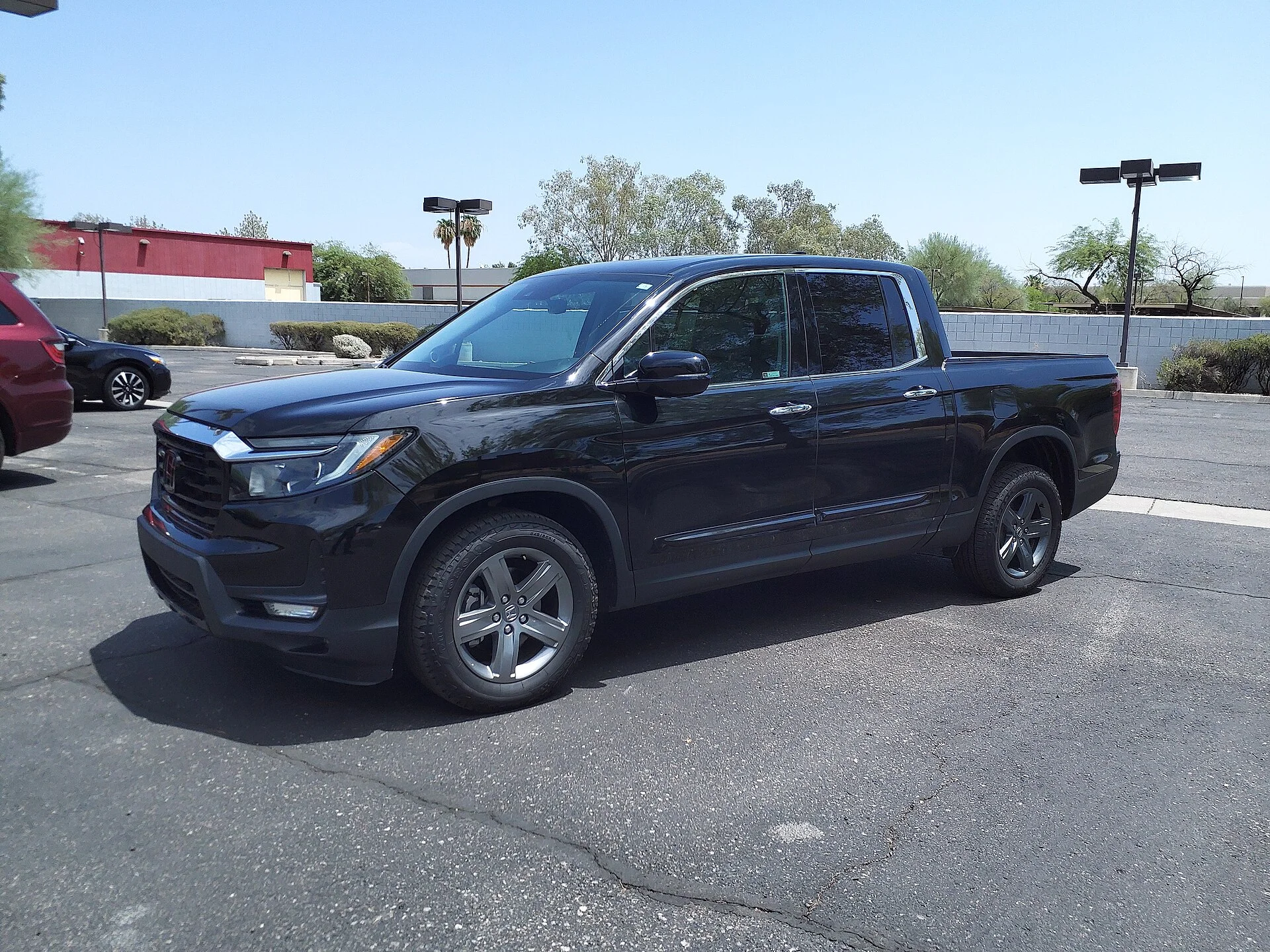 A 2023 Honda Ridgeline RTL-E, the current-generation unibody truck used for tailgate and platform sleeping in this guide.