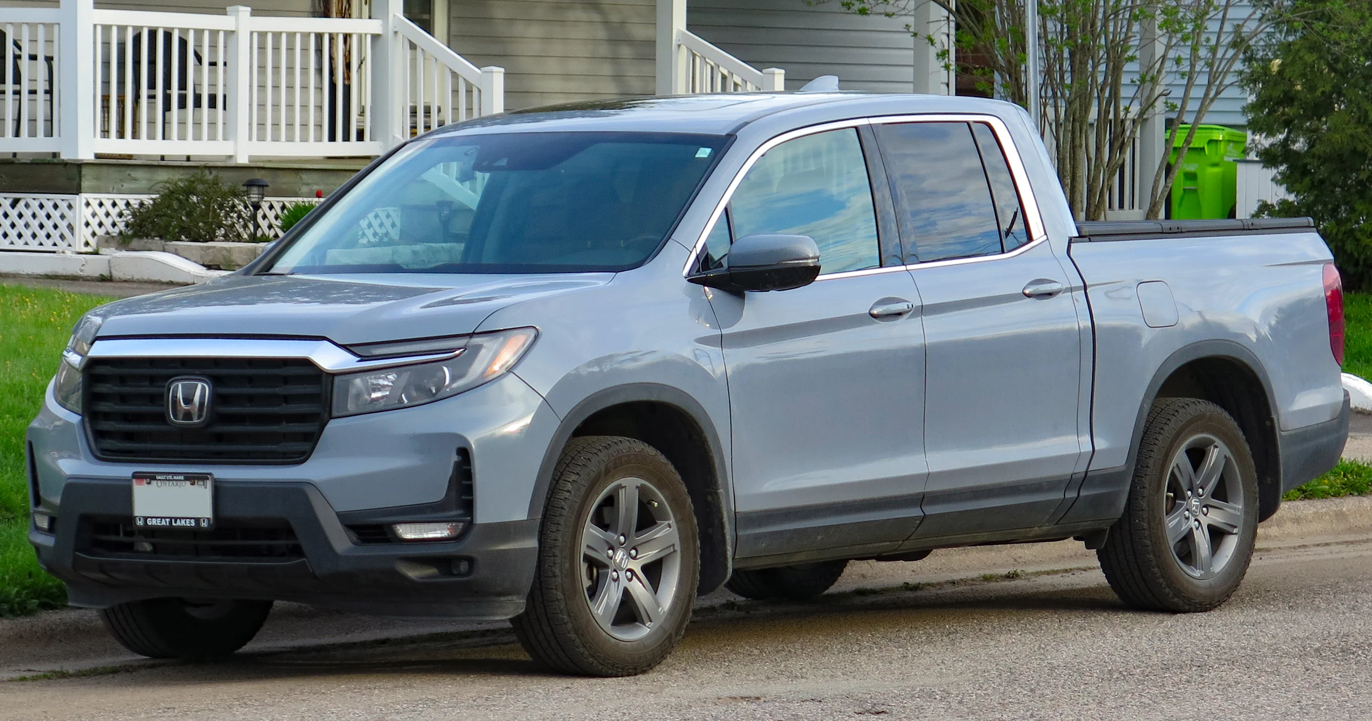 A Sonic Gray 2022 Honda Ridgeline Touring, the unibody pickup this camping guide treats as an SUV with a bed.