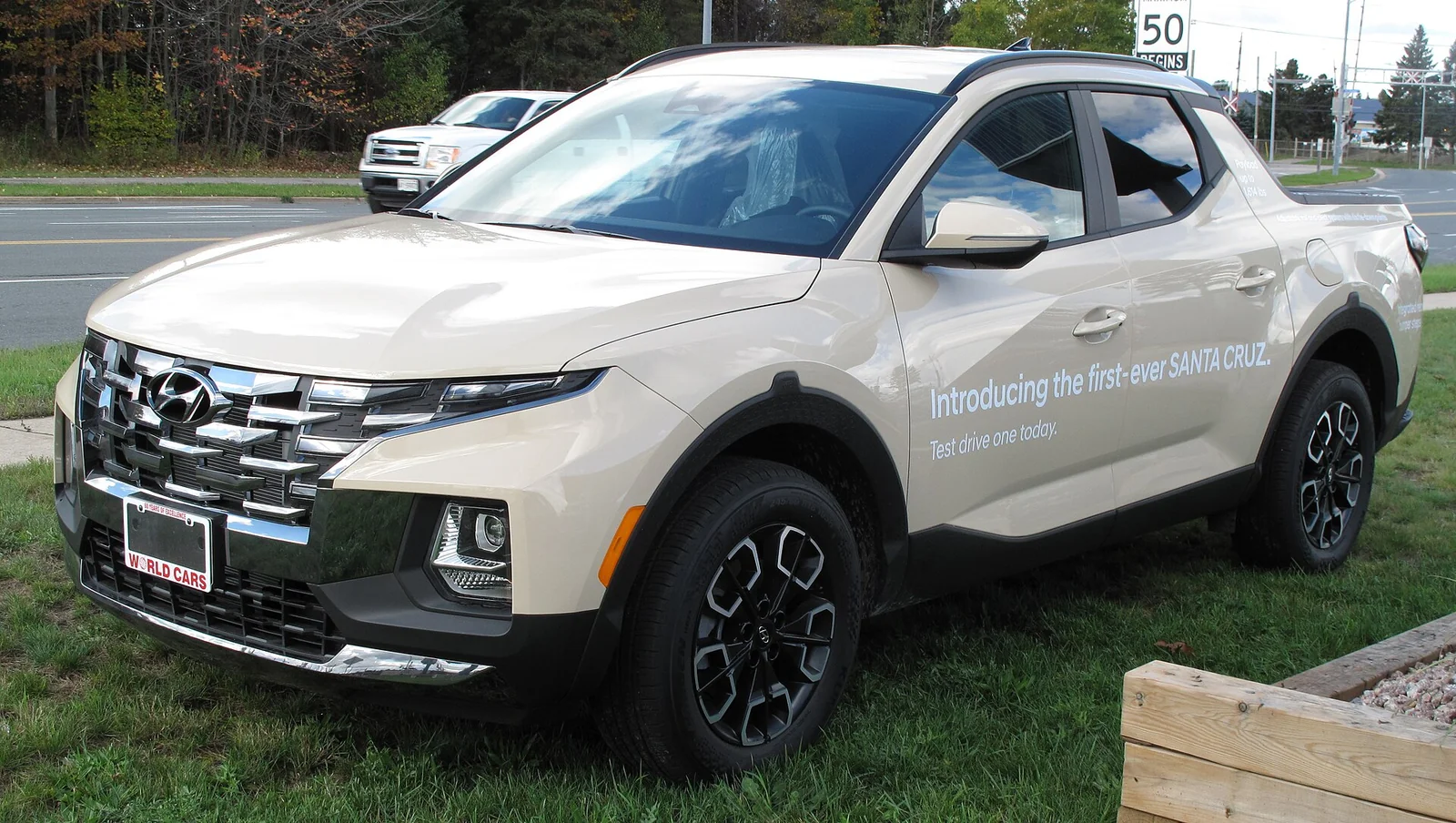 White Hyundai Santa Cruz compact pickup with its shorter, deeper truck bed