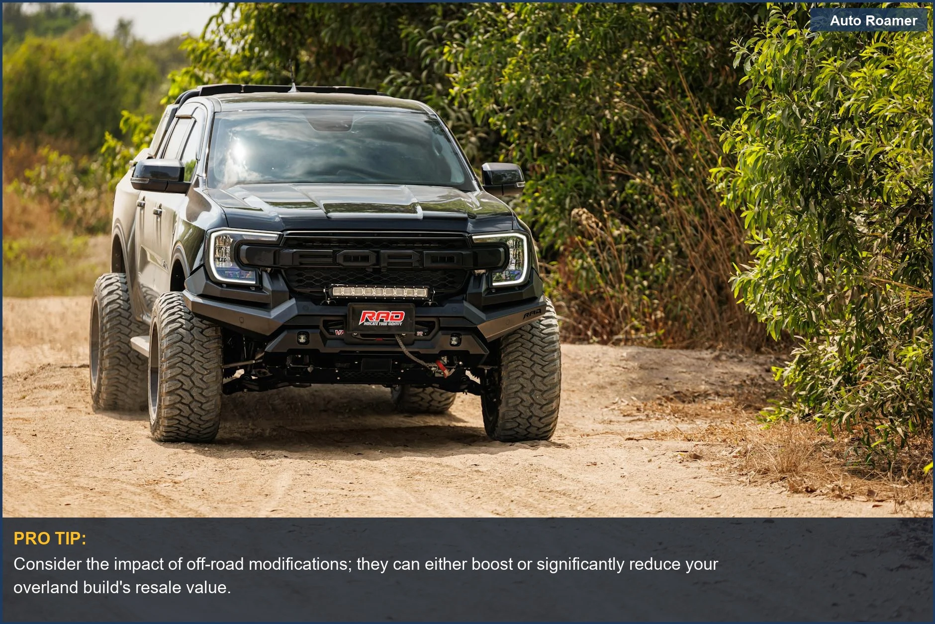 Black pickup truck off-roading, demonstrating how car depreciation affects resale value for overland builds.