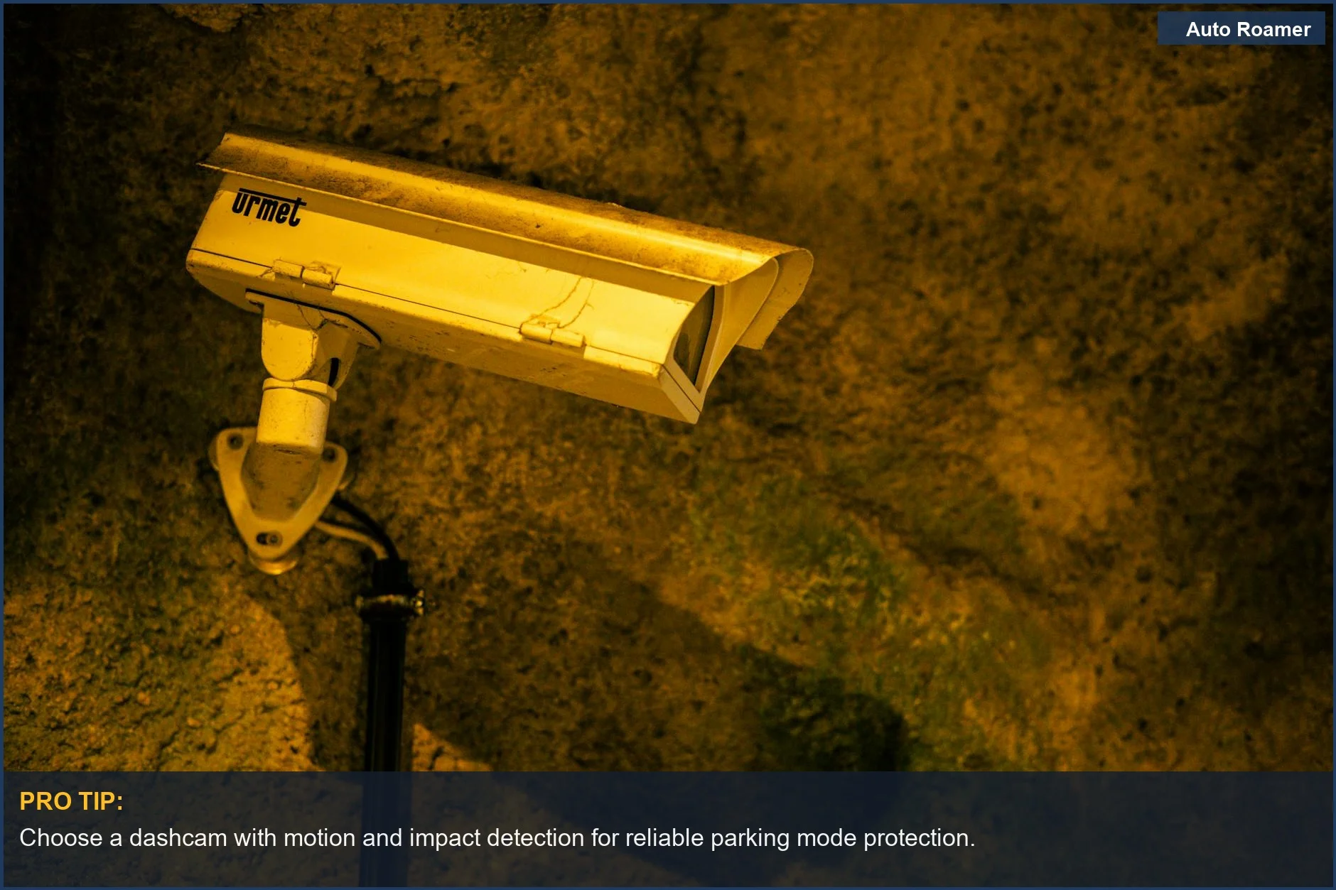 Close-up of a discreet security camera on a textured wall, symbolizing dashcam parking mode's protective features.