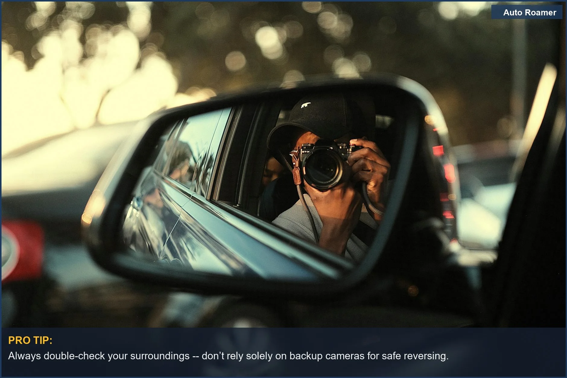 Photographer's reflection in a car mirror during sunset, capturing safety aspects of driving.