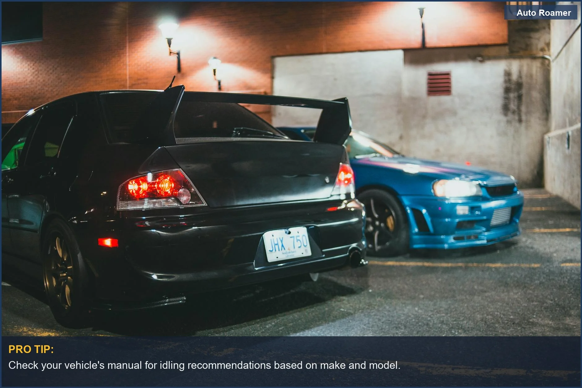 Black and blue sporty cars lit by streetlights in an urban setting.