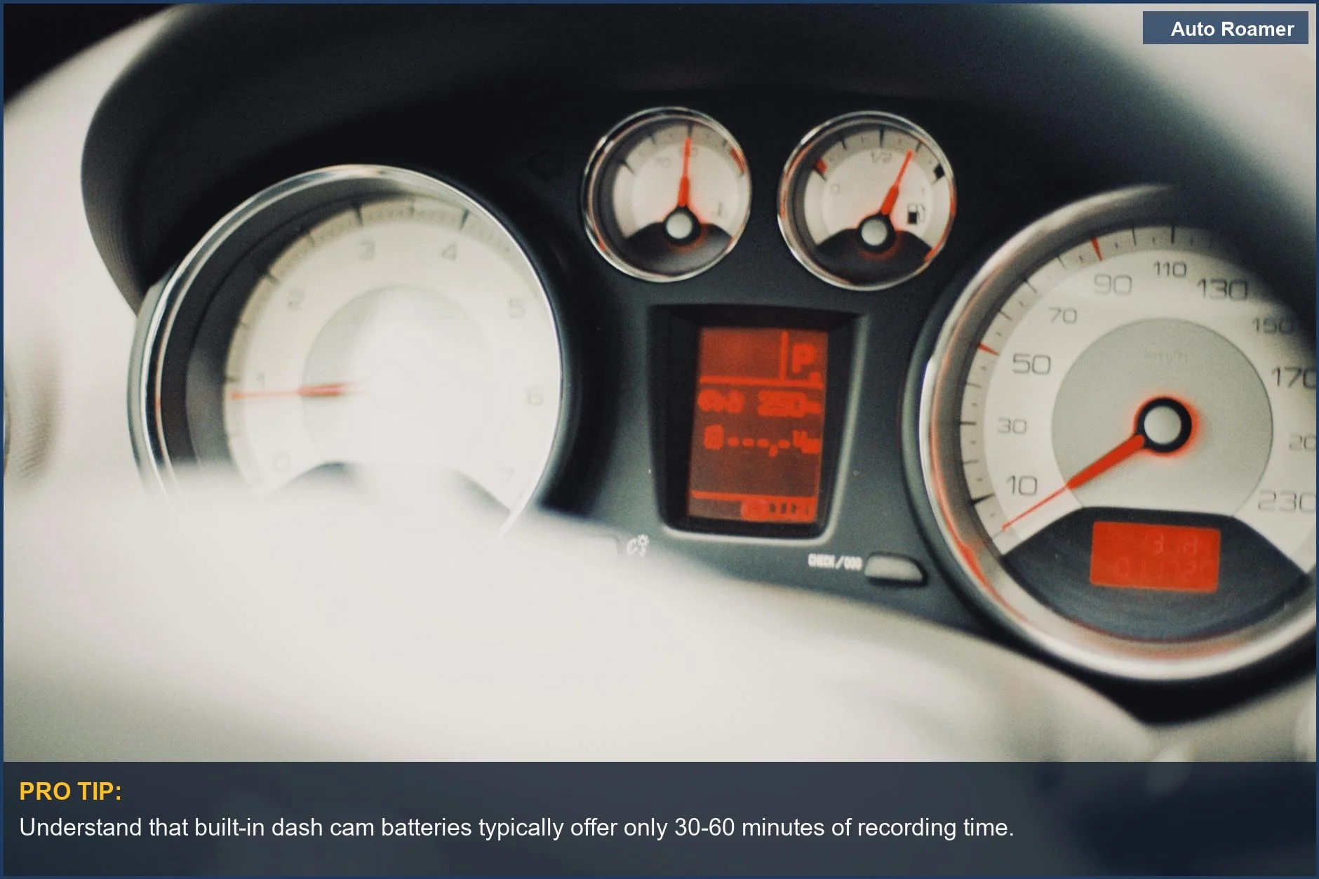 Car dashboard speedometer gauges showing current speed, illustrating dash cam battery duration.
