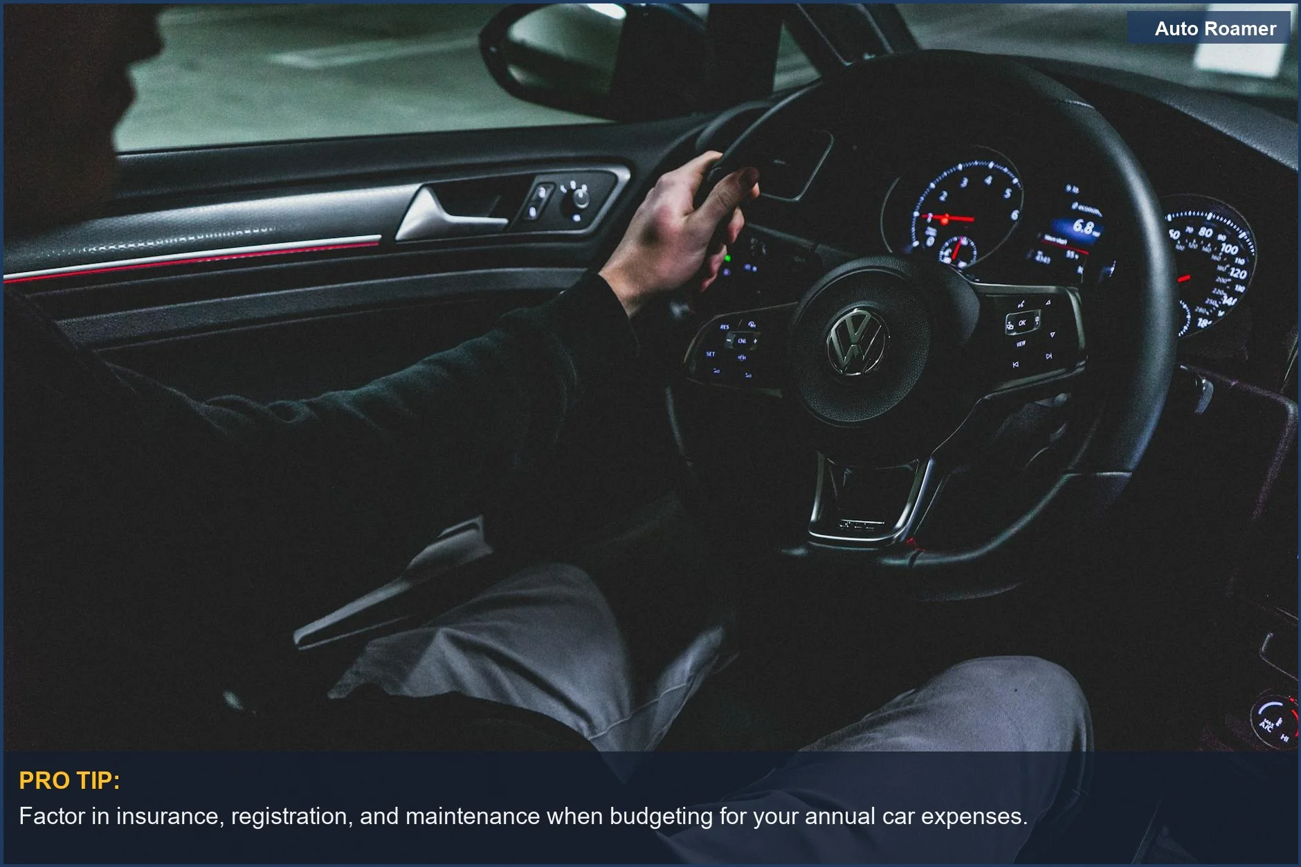 Night driving view from inside a car, dashboard lit, demonstrating the comprehensive cost of car ownership.