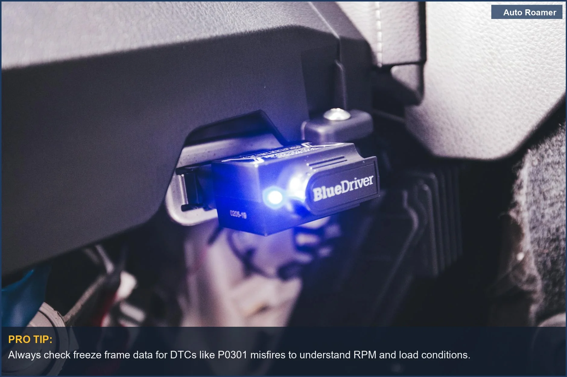 BlueDriver OBD2 electronic car diagnostic tool plugged into a vehicle's port.