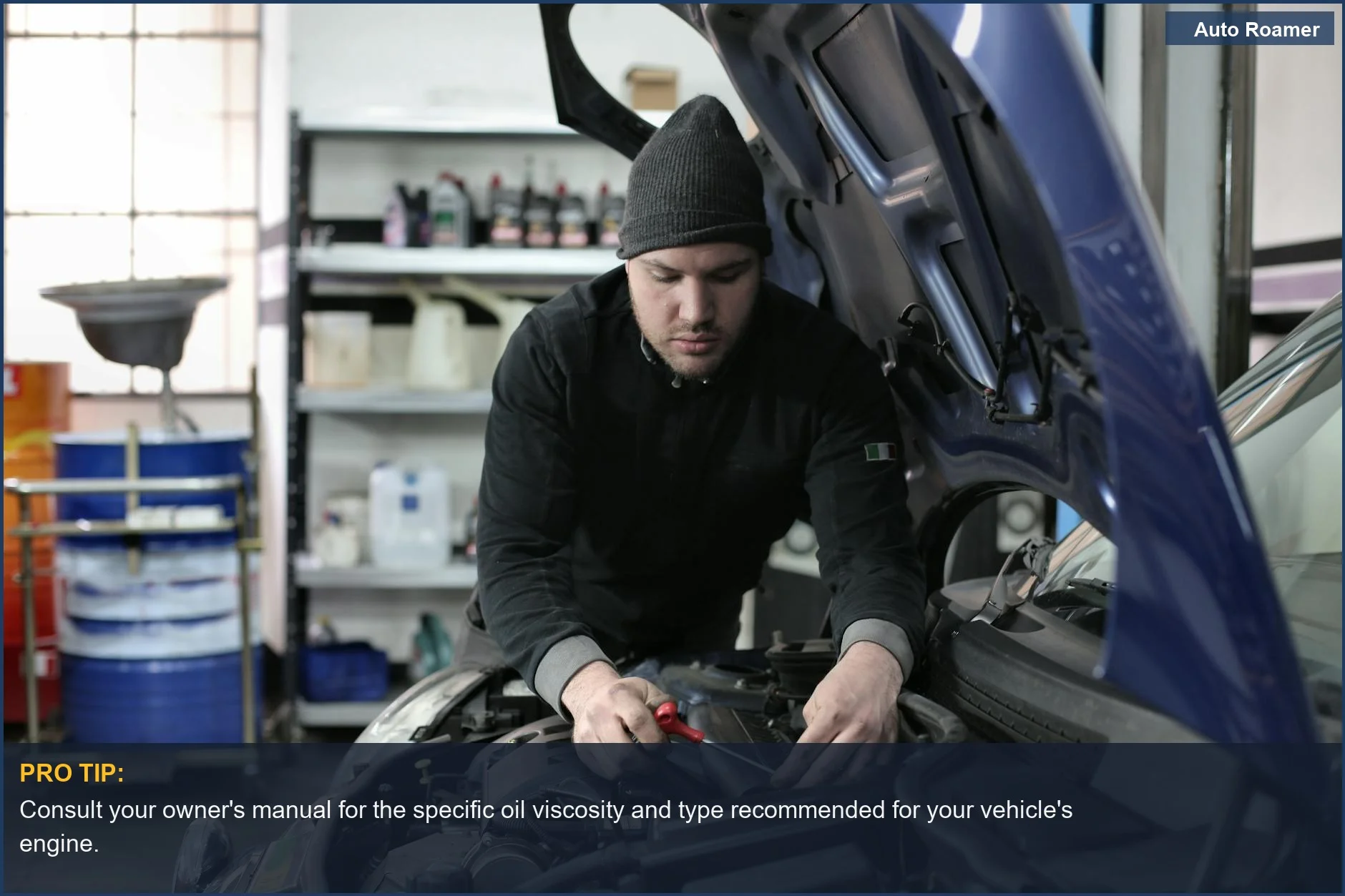 Man focused on engine repair under a car hood, illustrating the importance of choosing the right oil type.