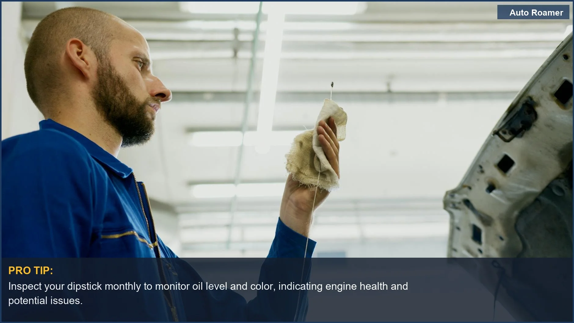 Mechanic checks car oil level with dipstick, highlighting modern oil change intervals beyond the old 3,000-mile rule.
