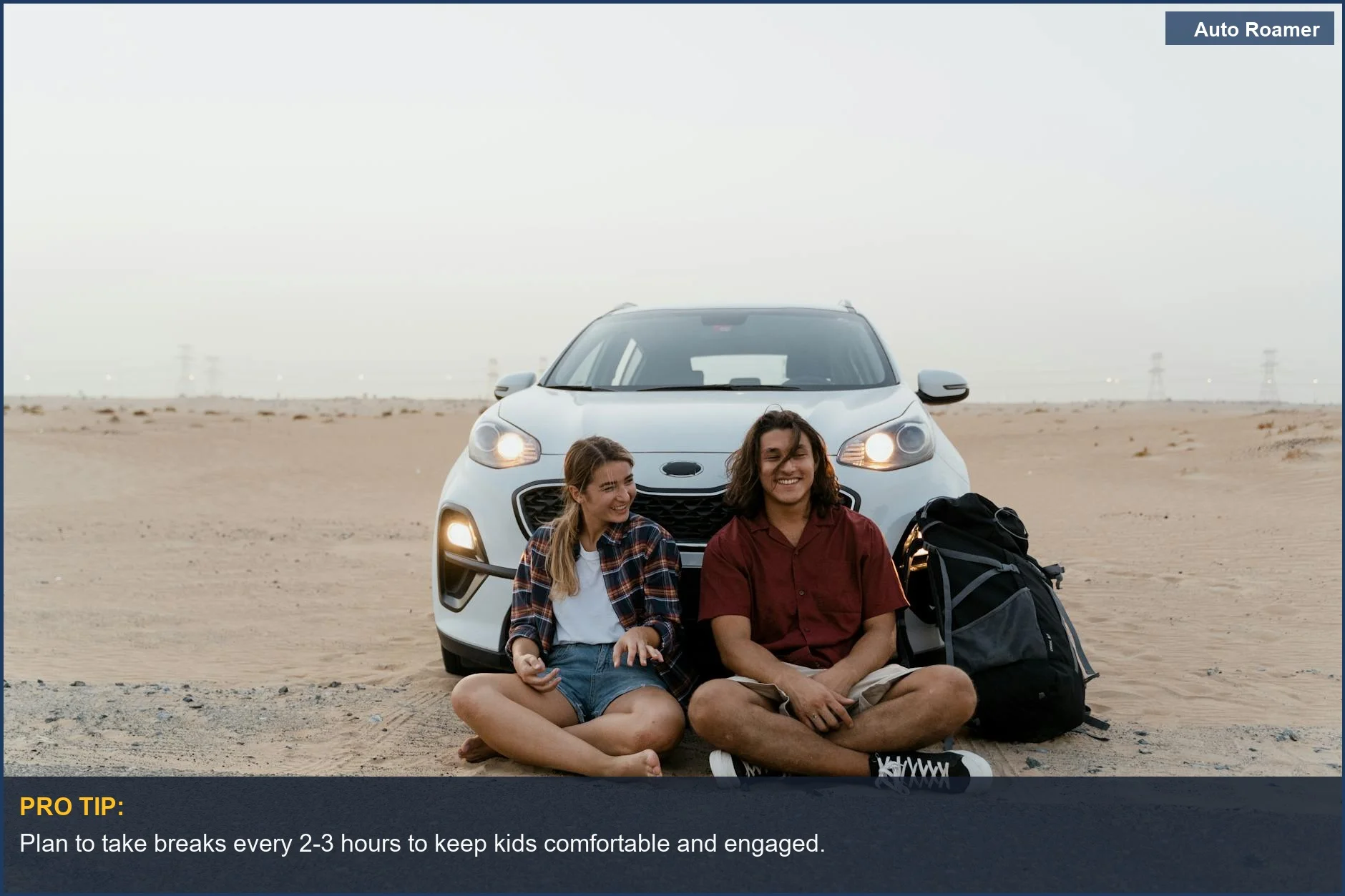 Young travelers relaxing by their car during a road trip with kids, enjoying the desert scenery.