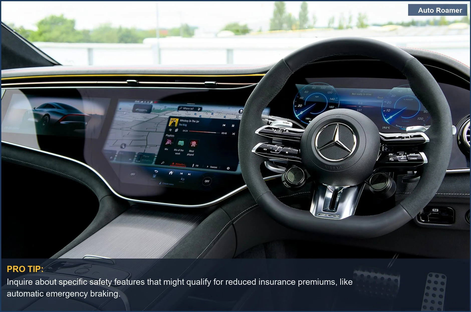 High-tech car dashboard with a large digital display and advanced steering wheel, influencing insurance rates.
