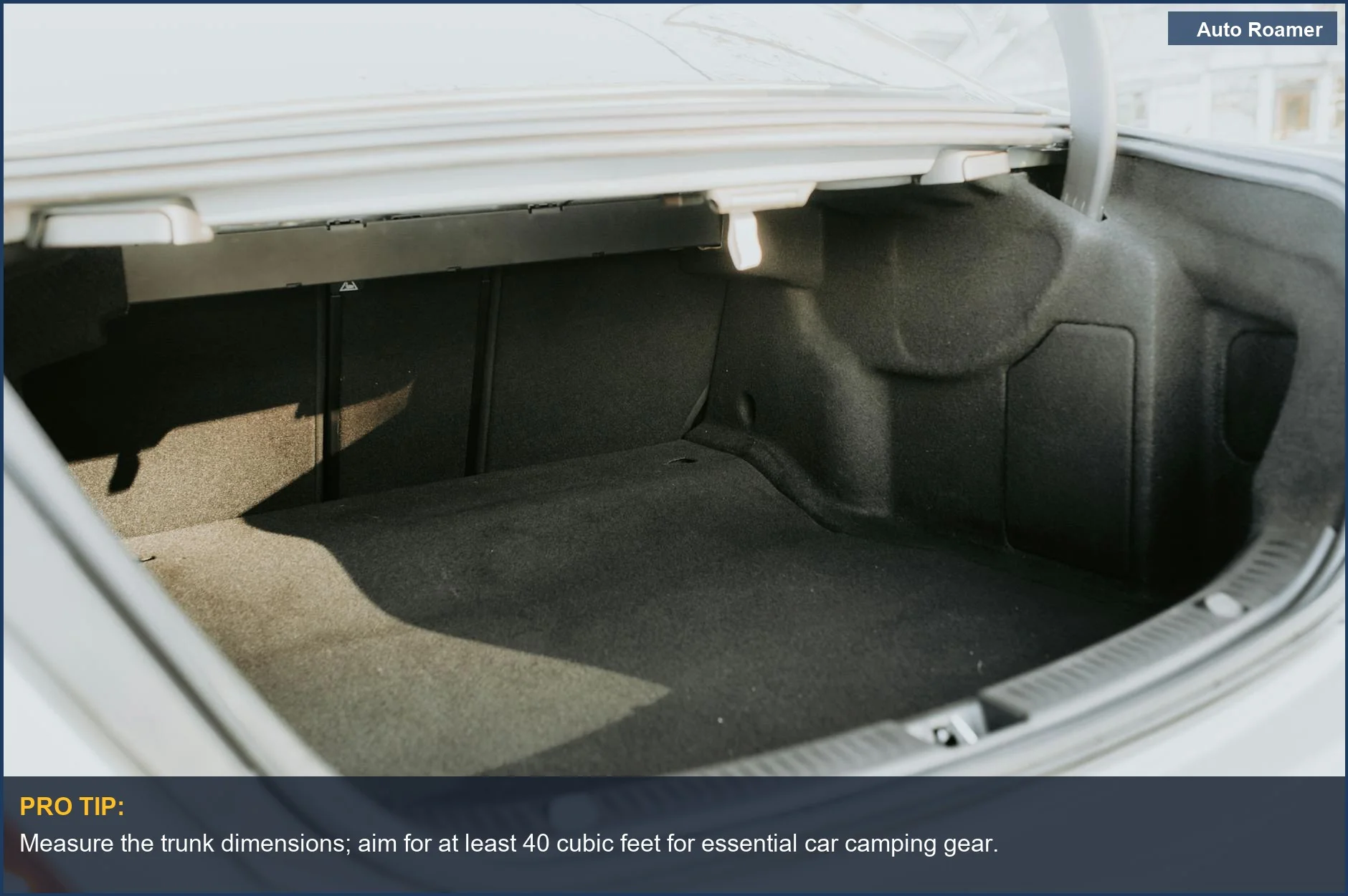 Empty, spacious car trunk illuminated by bright sunlight, perfect for car camping gear storage.