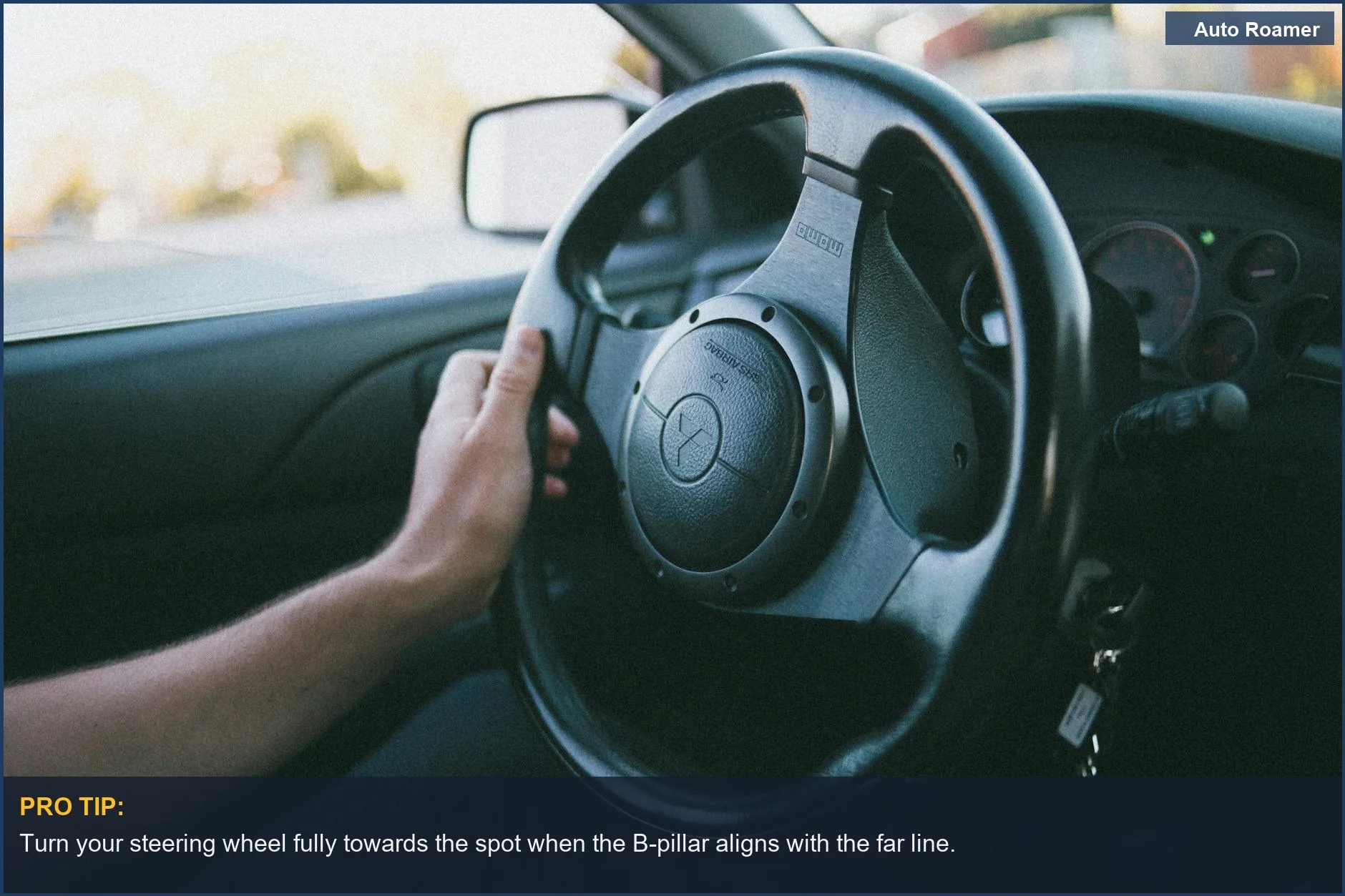 Close-up of a hand gripping a steering wheel, showing control during a reverse parking maneuver.