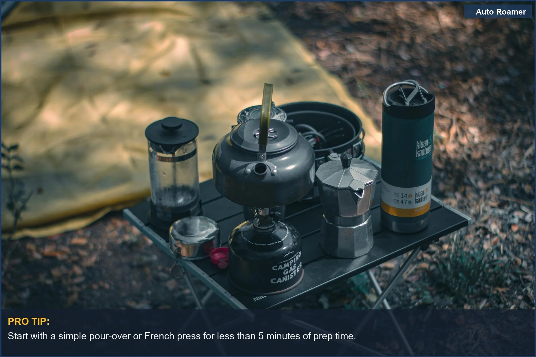 Cozy camping coffee station with brewing equipment and a tent in the background.