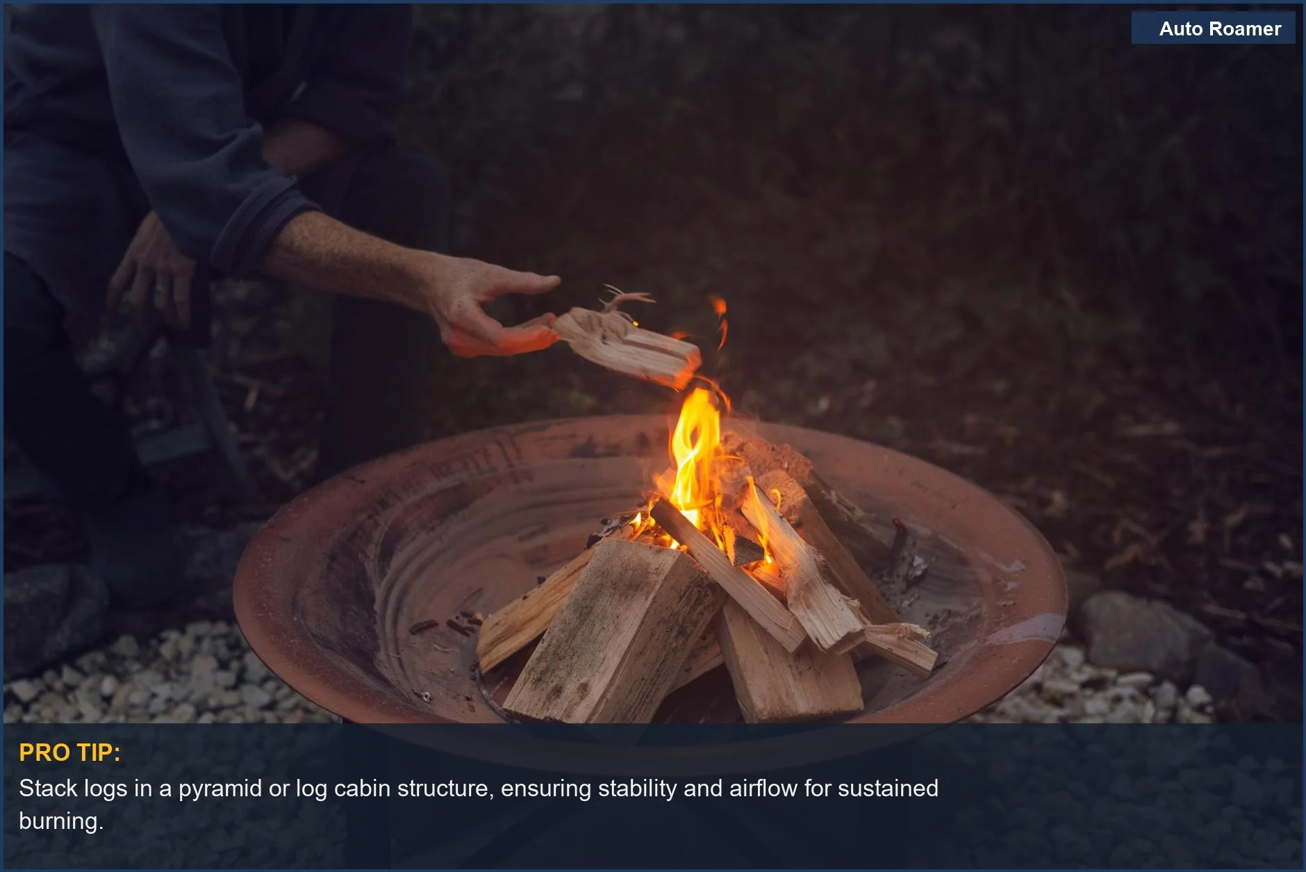 Man carefully adds wood to a stable outdoor campfire pit, demonstrating campfire building tips.
