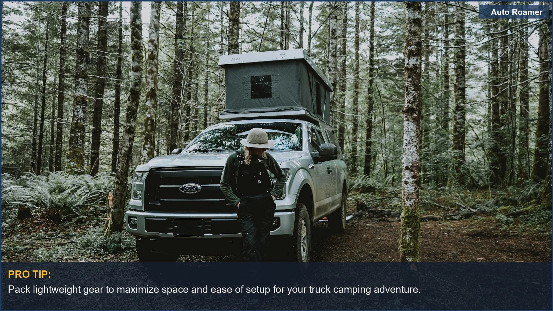 Woman setting up a tent on a pickup truck in Oregon's lush woods.