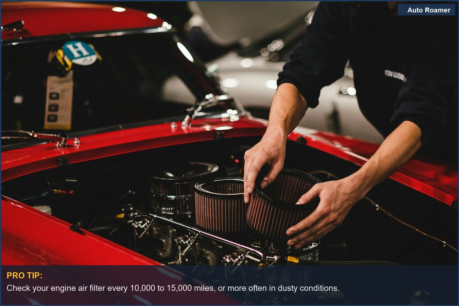 Mechanic's hands working on a car engine, focusing on the air filter area for replacement.