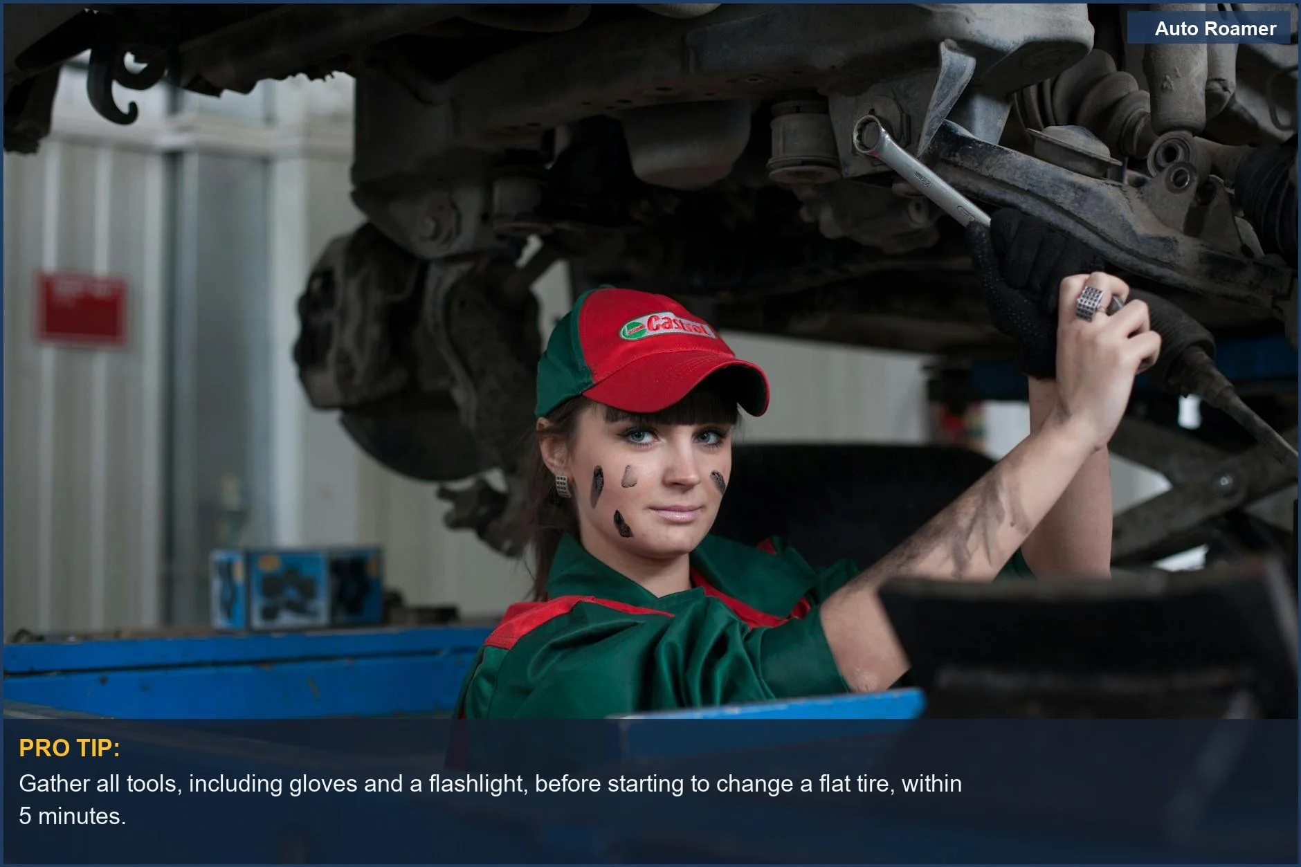 Female mechanic focused while working on a car's tire in an auto repair shop.