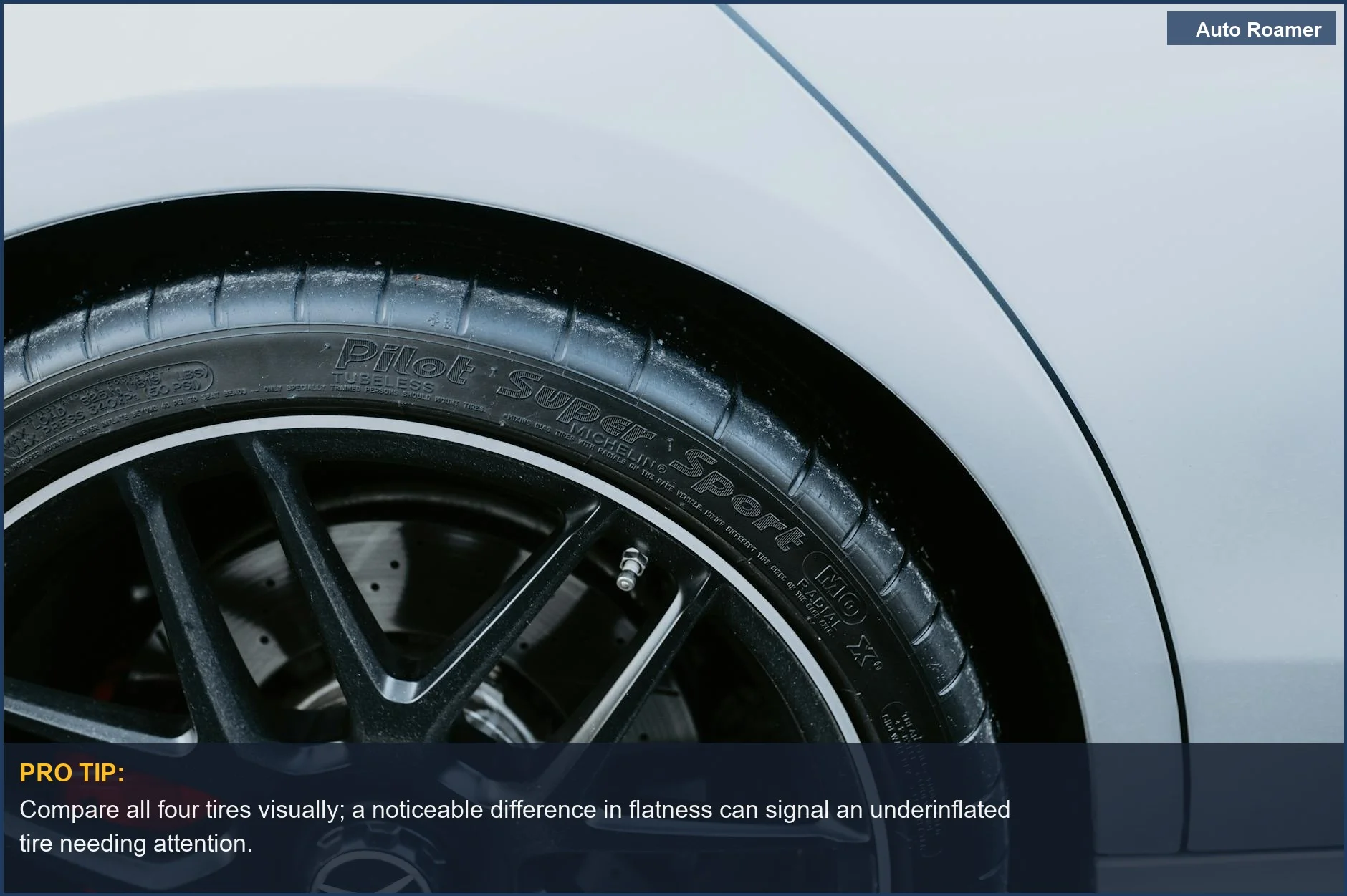 Detailed view of an alloy wheel and high-performance tire, illustrating visual cues for checking tire pressure without a gauge.