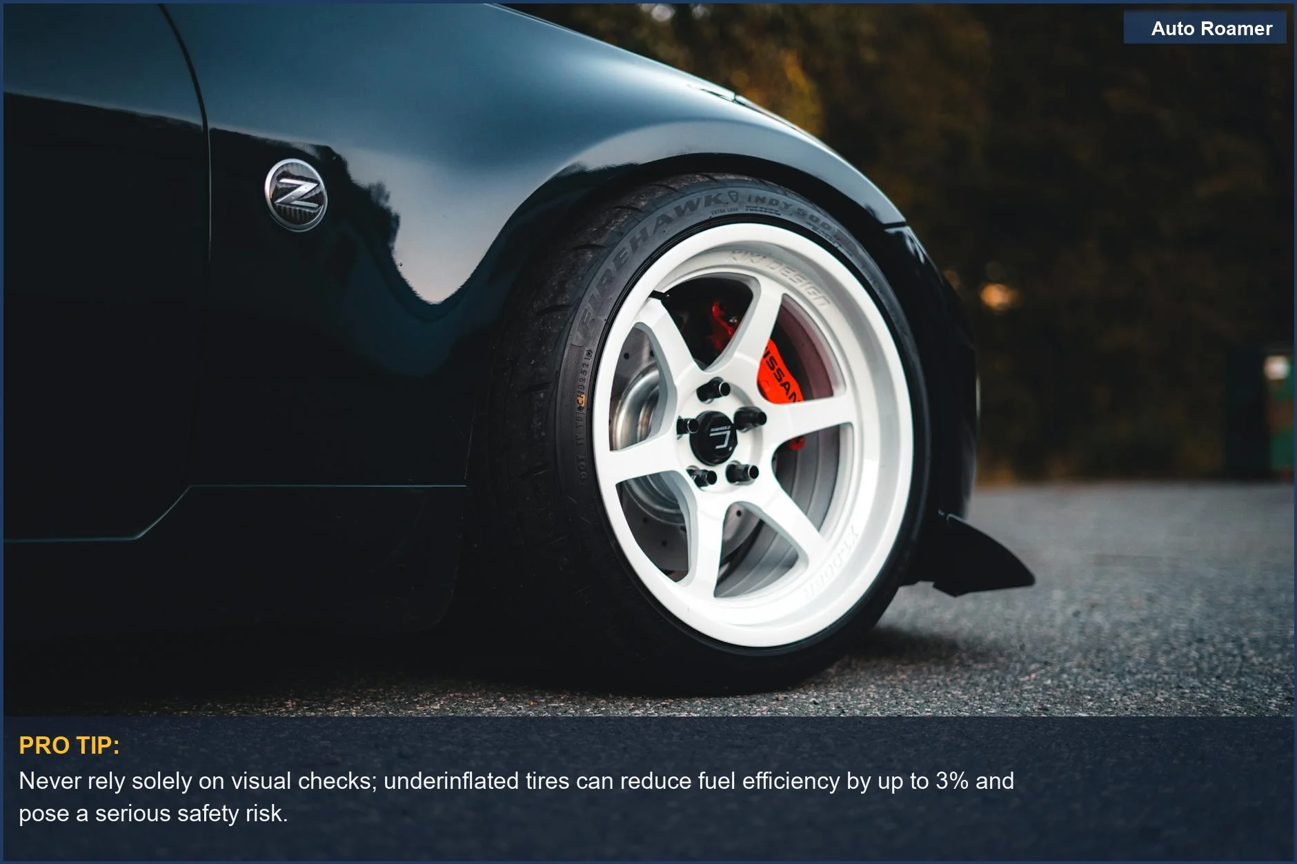 Sleek black sports car wheel and rim on asphalt, emphasizing the risks of improper tire inflation when checking pressure without a gauge.