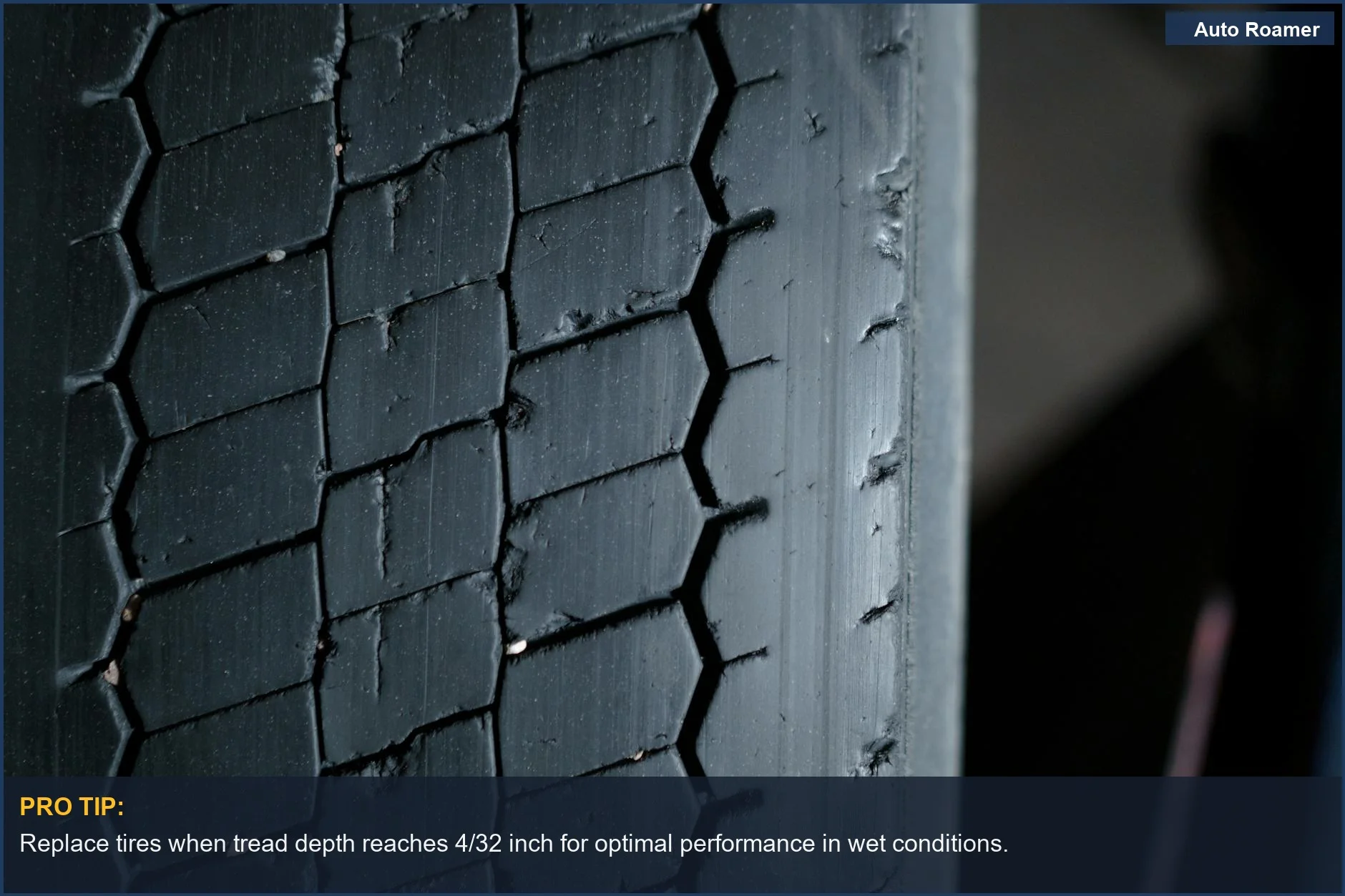 Detailed view of a worn tire tread with distinct grooves and patterns, highlighting the need for replacement.