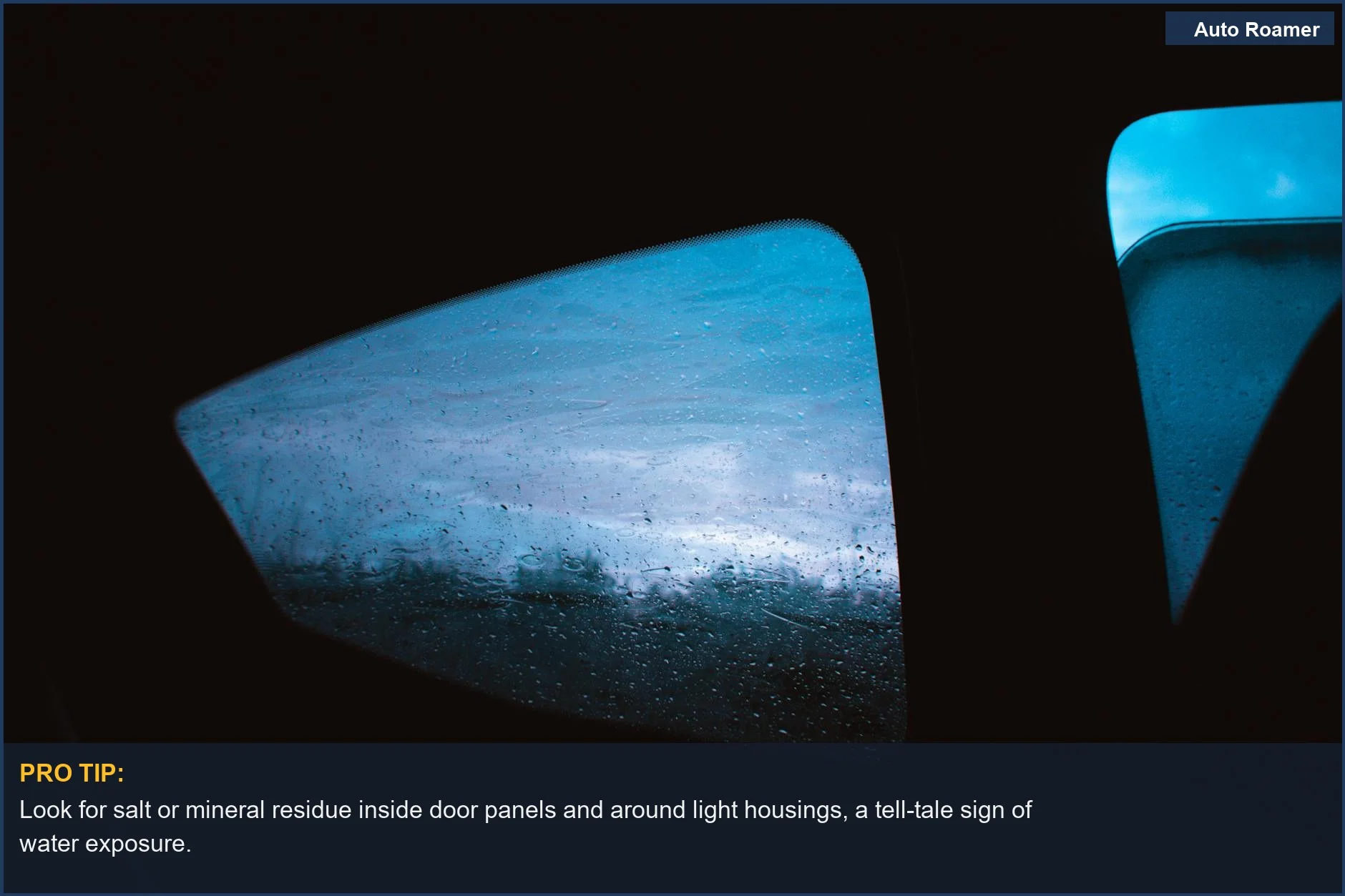 Raindrops on a car window, setting the mood for checking used cars for water damage before van conversion.