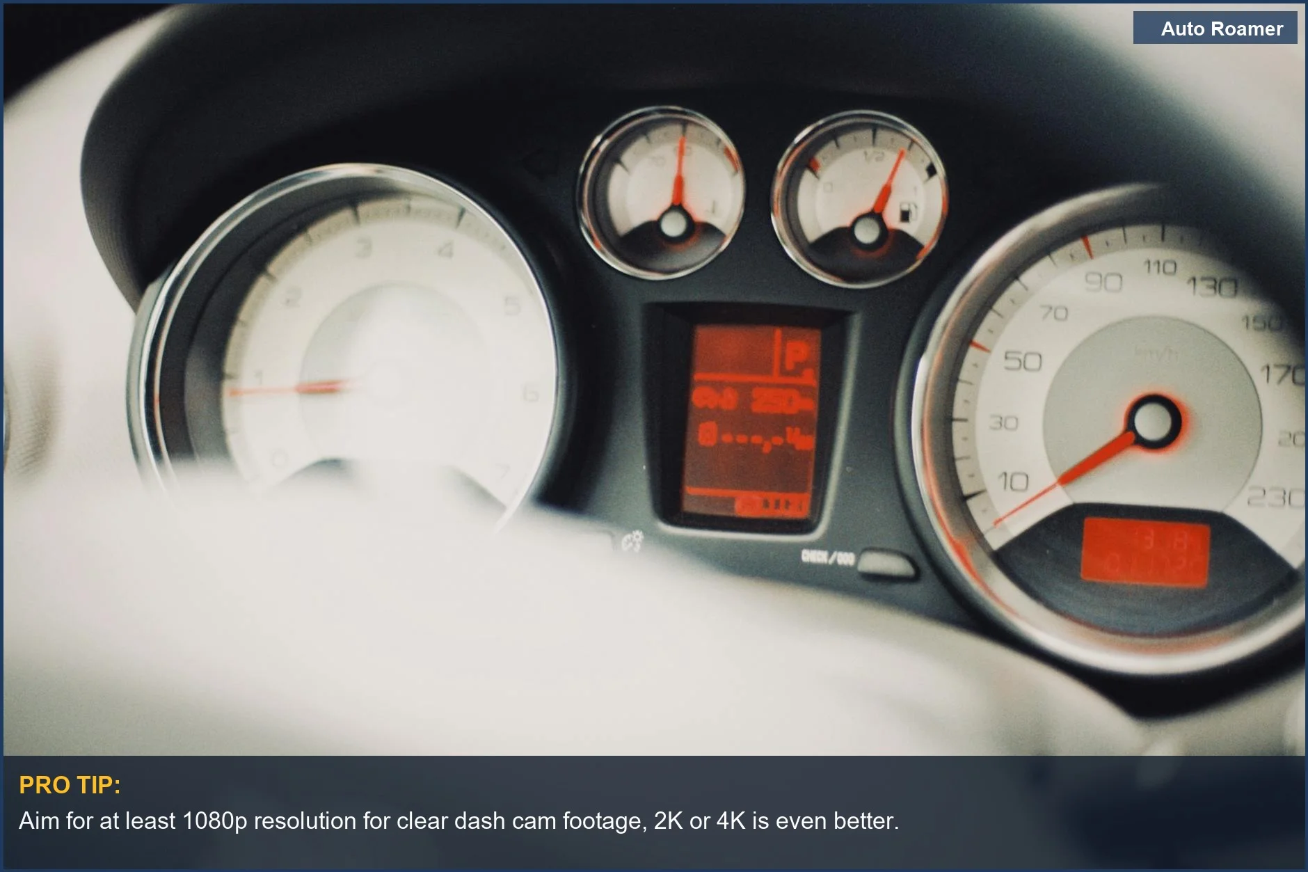 Car dashboard with speedometer and gauges, crucial for evaluating dash cam video quality.