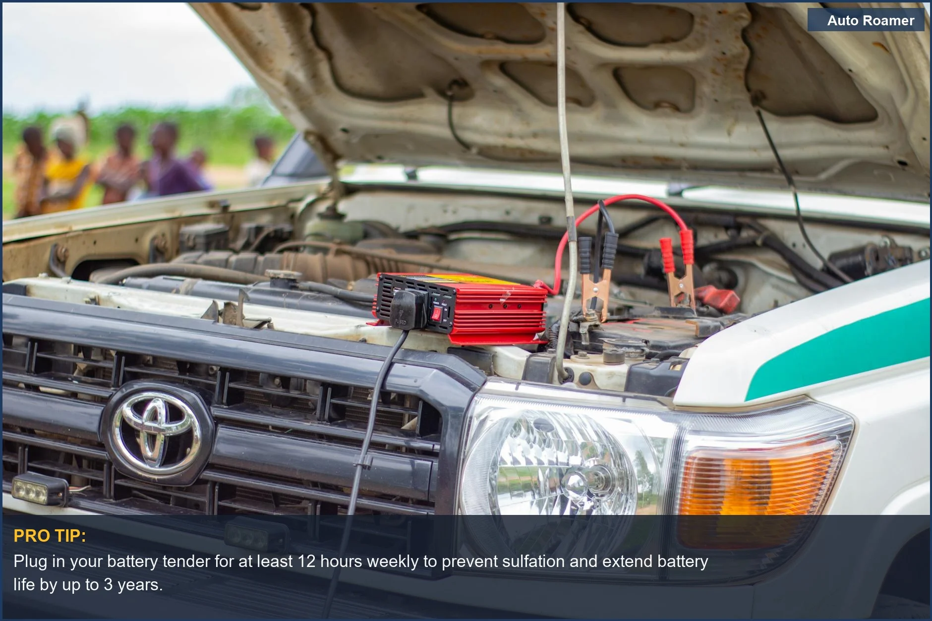 Car battery charger connected to engine for optimal car battery maintenance in Malawi.