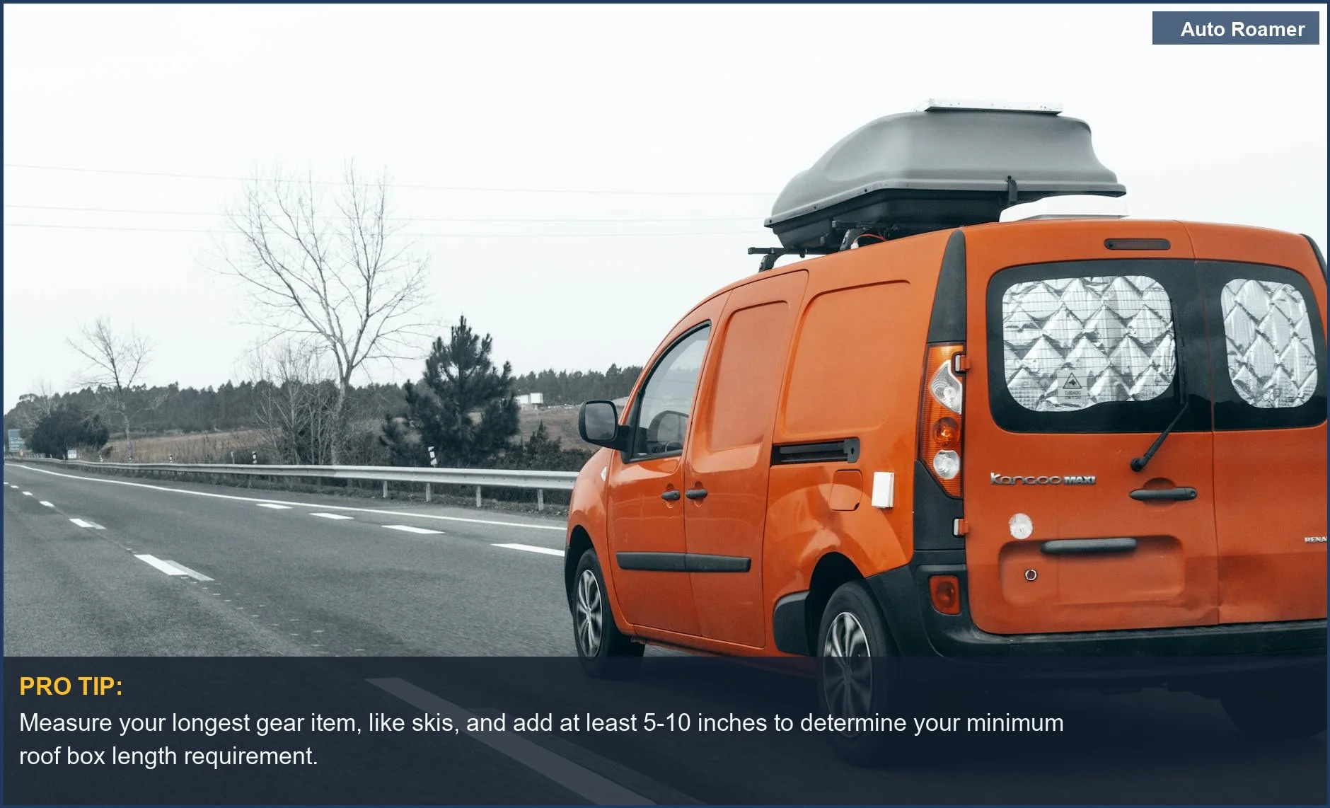 Bright orange van with roof box on highway, essential for determining the right roof box size for long gear like skis.
