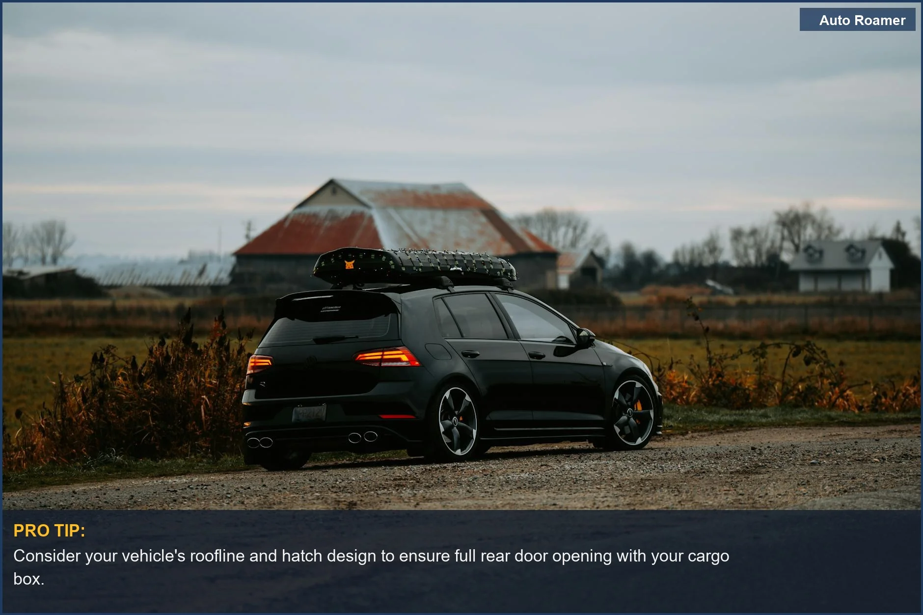 Stylish black hatchback with roof rack parked in a rural autumn setting, considering cargo box dimensions.