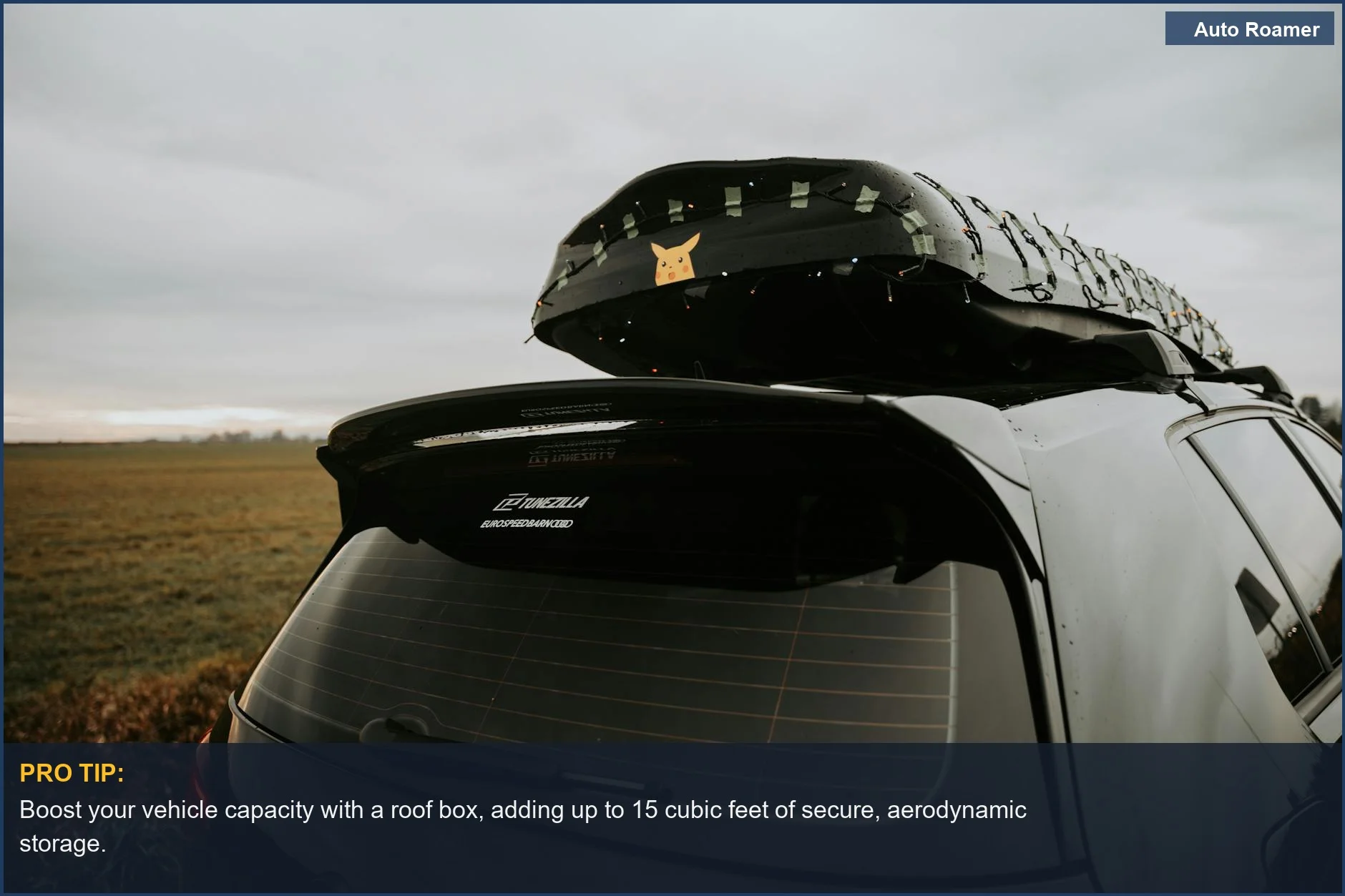Car with illuminated roof box, ideal for maximizing vehicle capacity on road trips.