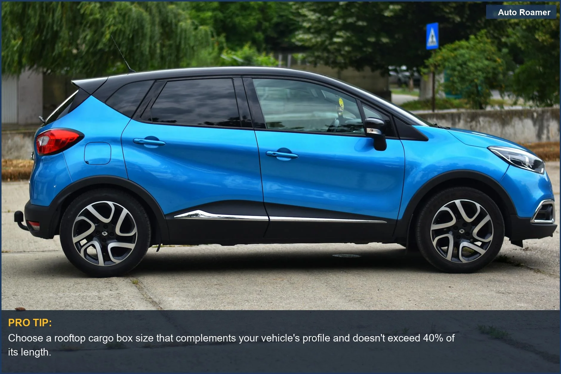Blue compact SUV with a sleek rooftop cargo box, ideal for urban travel.