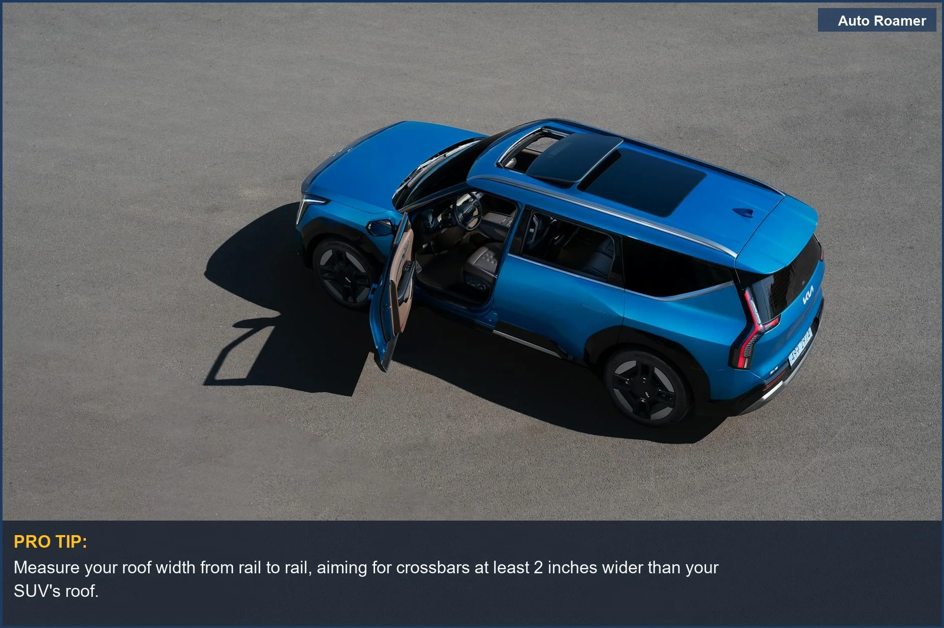 Blue SUV with open door on asphalt, highlighting the importance of measuring roof rack dimensions for your vehicle.